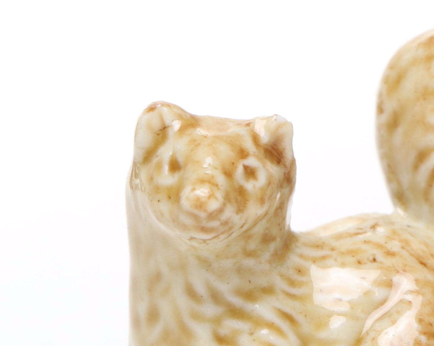 Animal Ceramic Figurines Featuring Raccoons, Rhinoceroses, and Giraffes