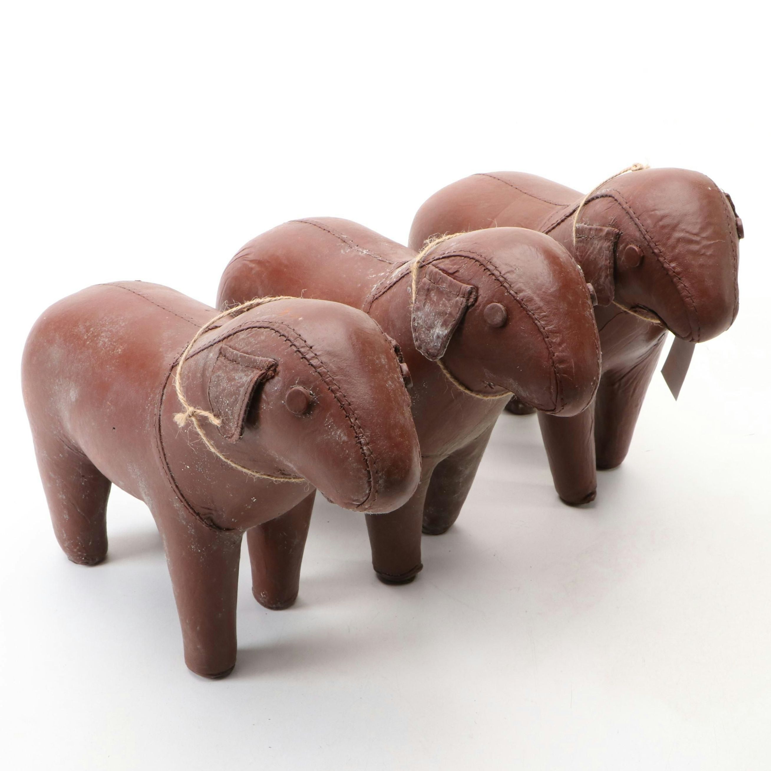 Three Stitched Brown Leather Dogs