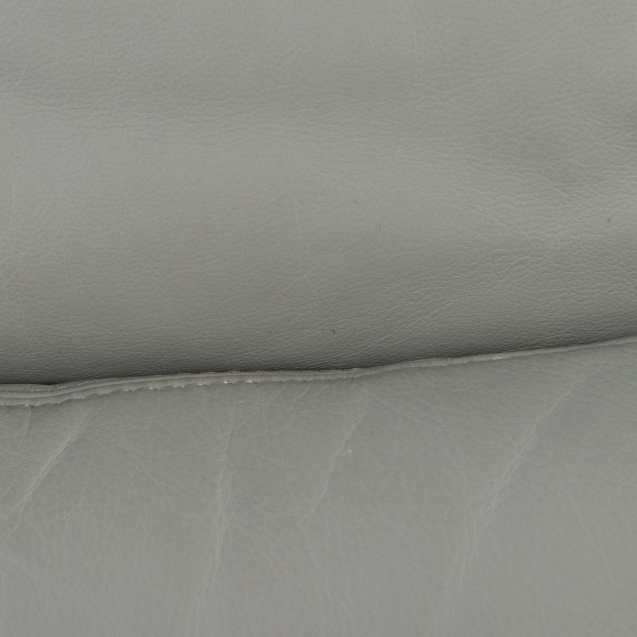 Carson's Modernist Grey Leather Armchair and Ottoman, Late 20th Century