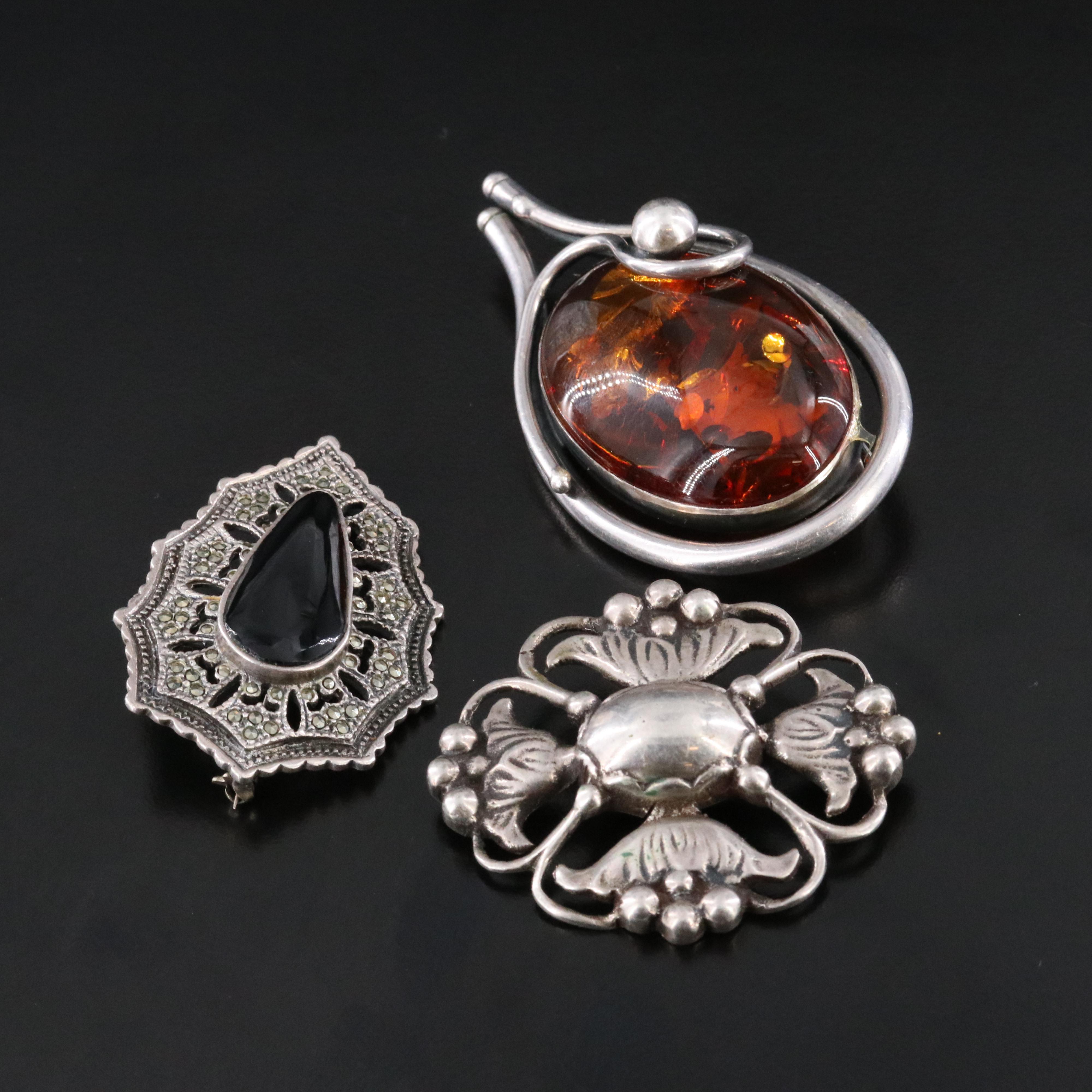 Amber and Black Onyx Featured in Sterling Jewelry