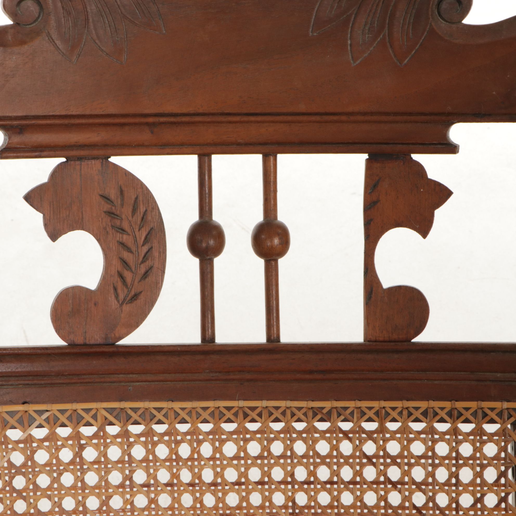 Cane and Carved Wood Rocking Chair