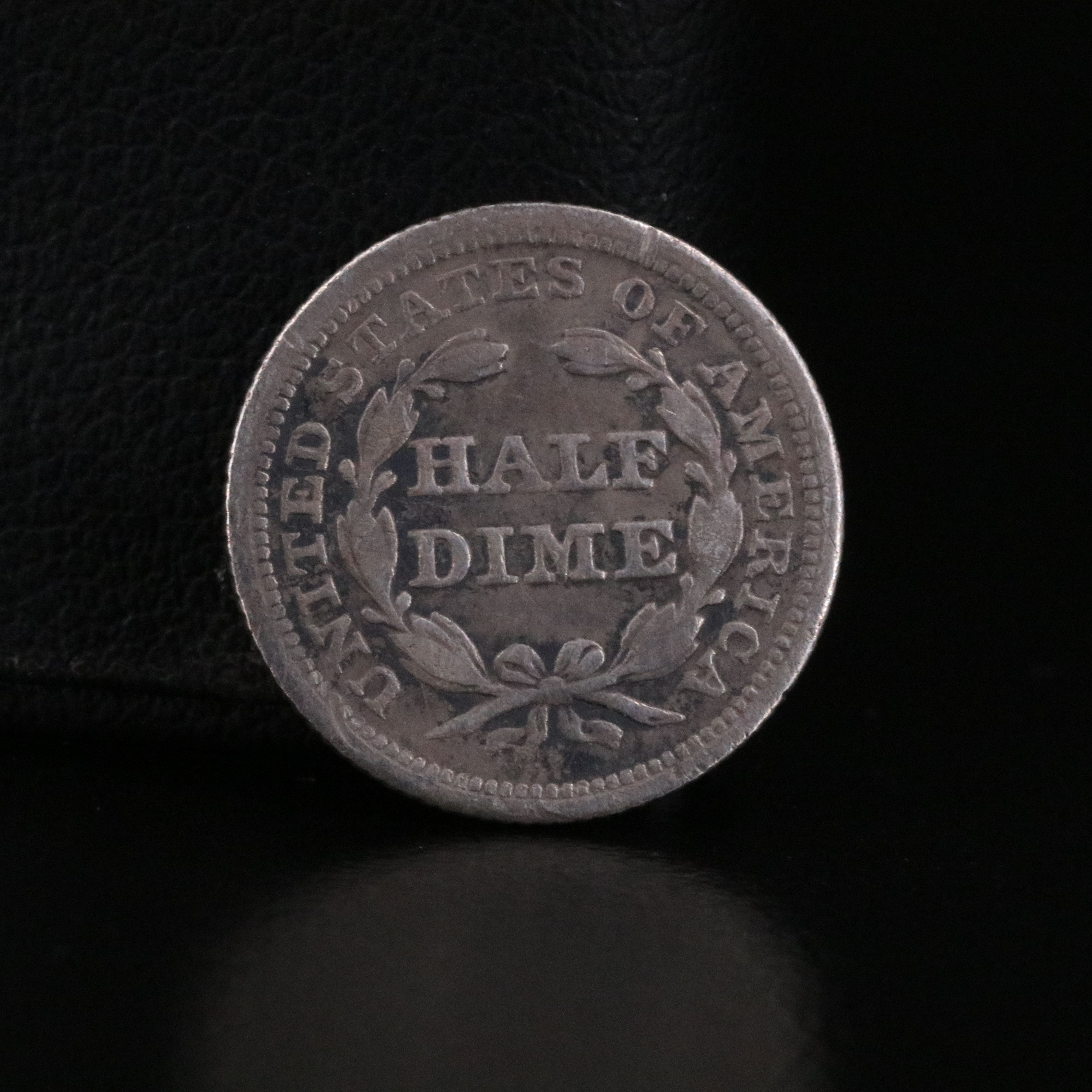 Three Early Capped Bust and Seated Liberty Coins with an 1831 Capped Bust Dime