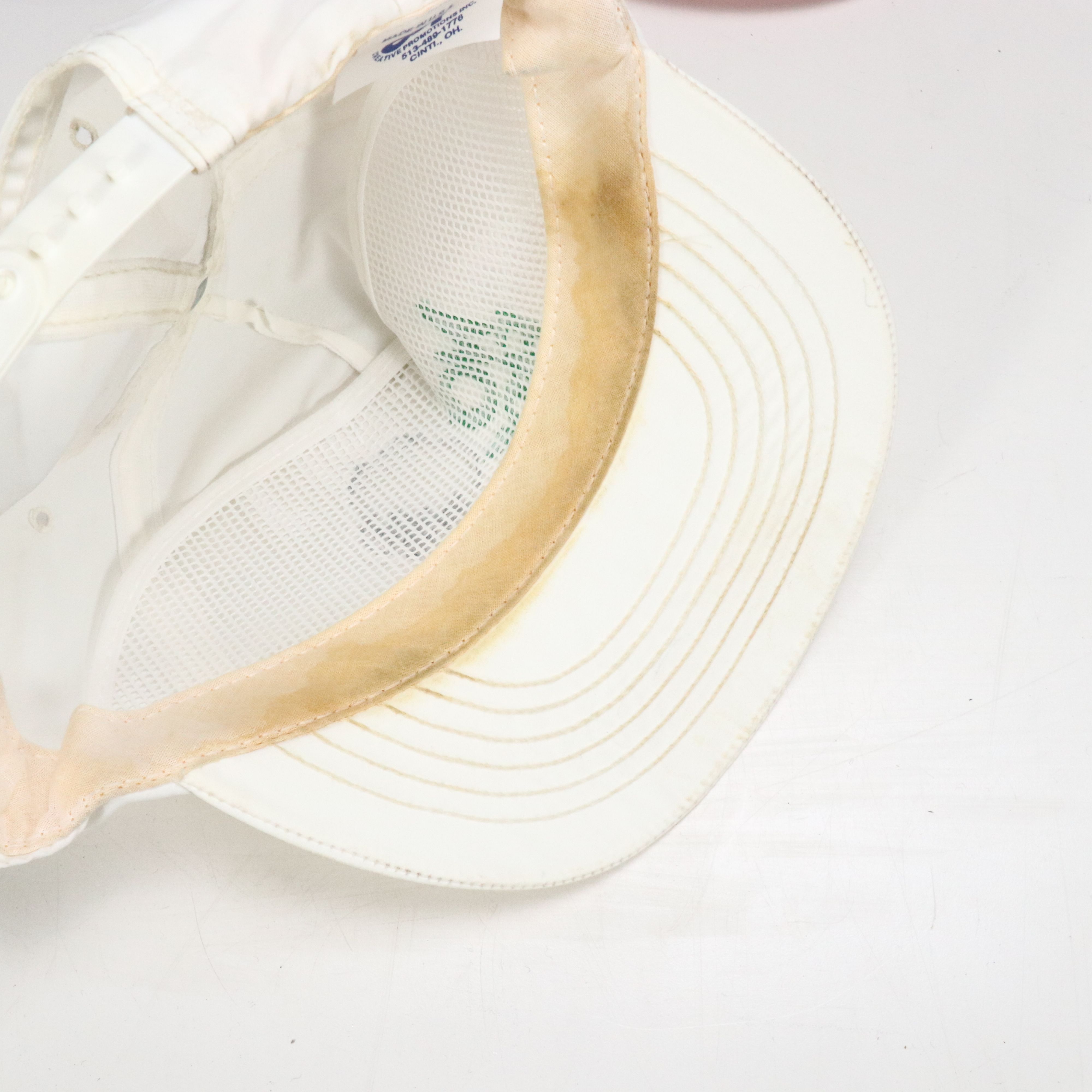 Assorted Baseball Caps and Wooden Display Featuring Marlboro, NASCAR