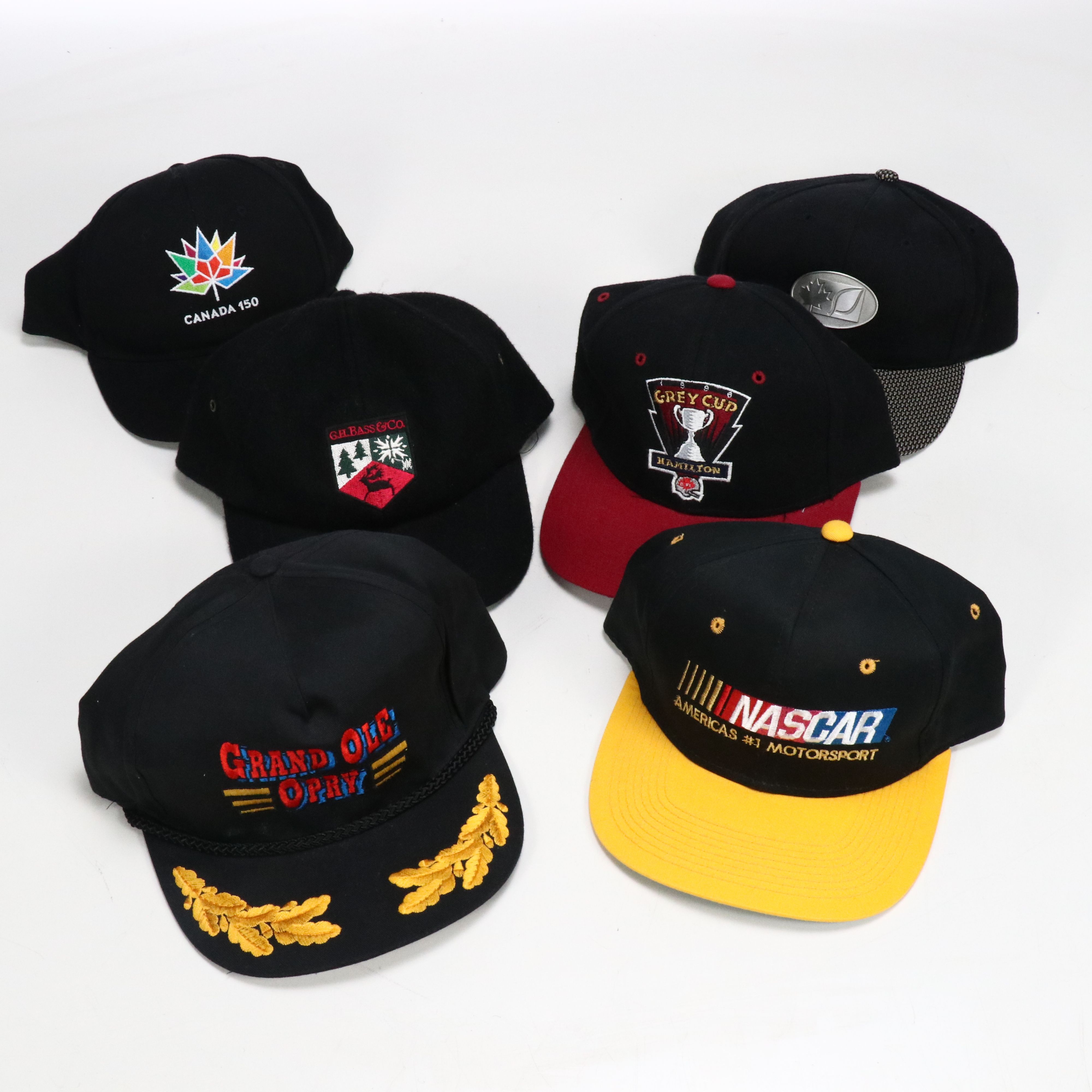 Assorted Baseball Caps and Wooden Display Featuring Marlboro, NASCAR