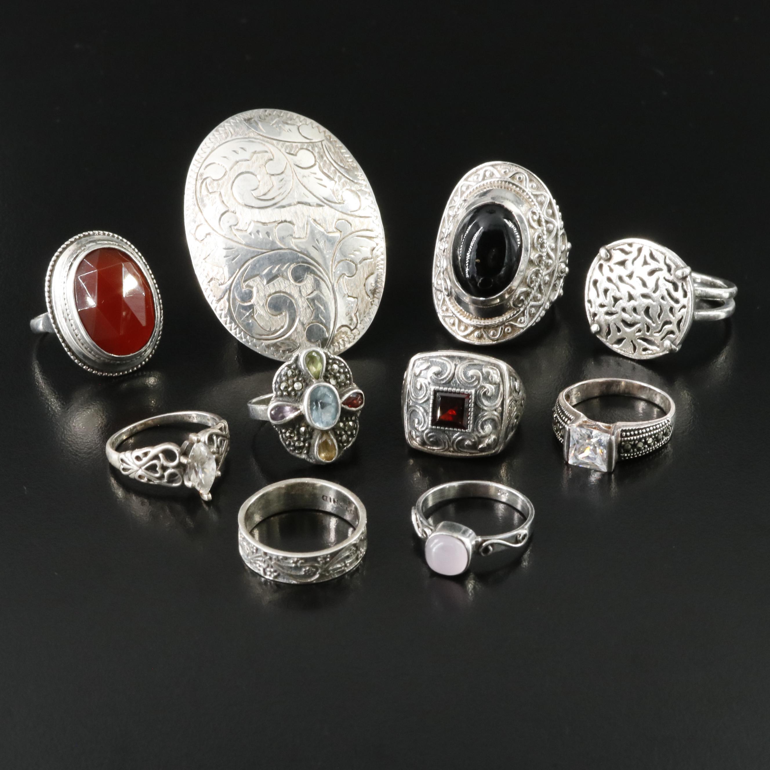 Sterling and 835 Silver Ring Collection Including Carnelian and Garnet