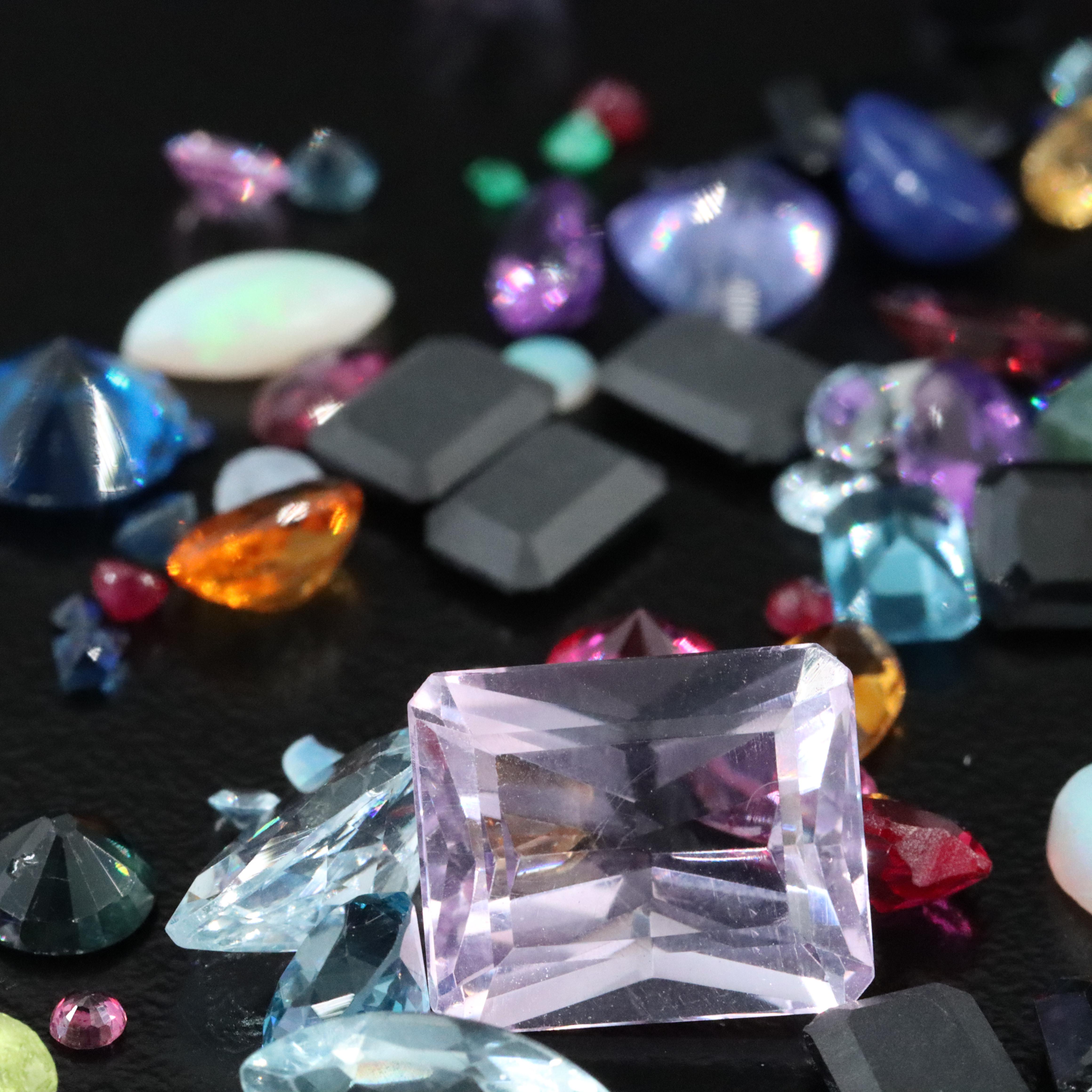 Loose Mixed Gemstone Lot Including Opal, Onyx, and Lab Grown Ruby