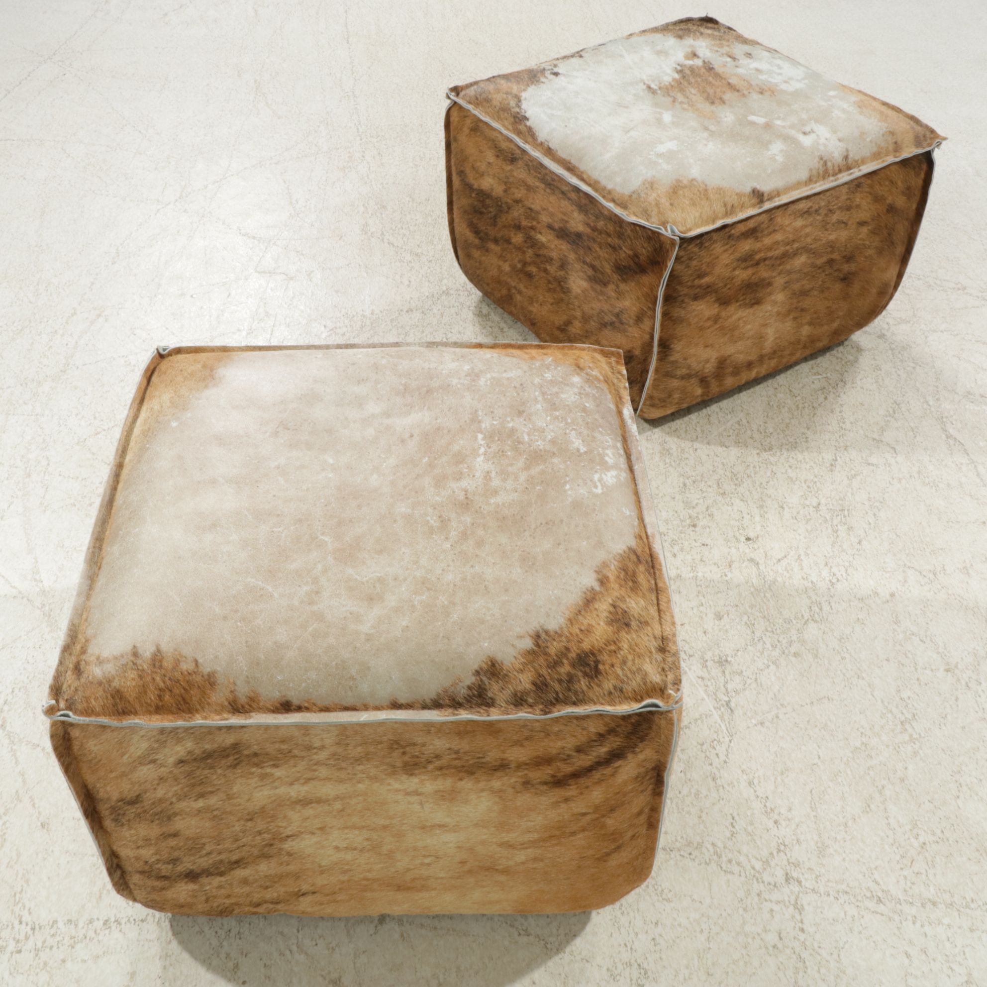 Pair of Arhaus Cowhide Upholstered Footstools