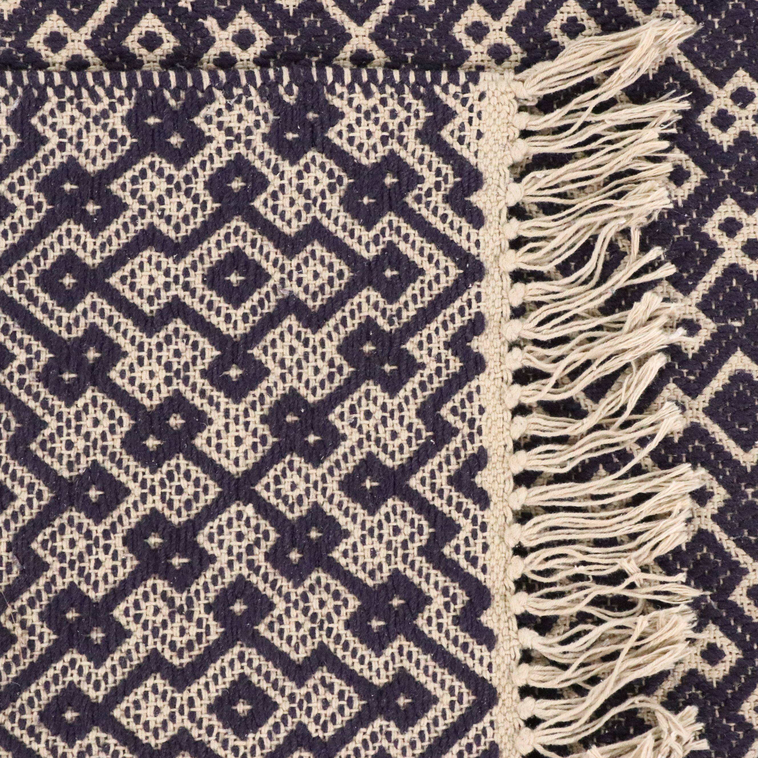 Navy Blue and White Geometric 4' x 7' Woven Tasseled Accent Rug
