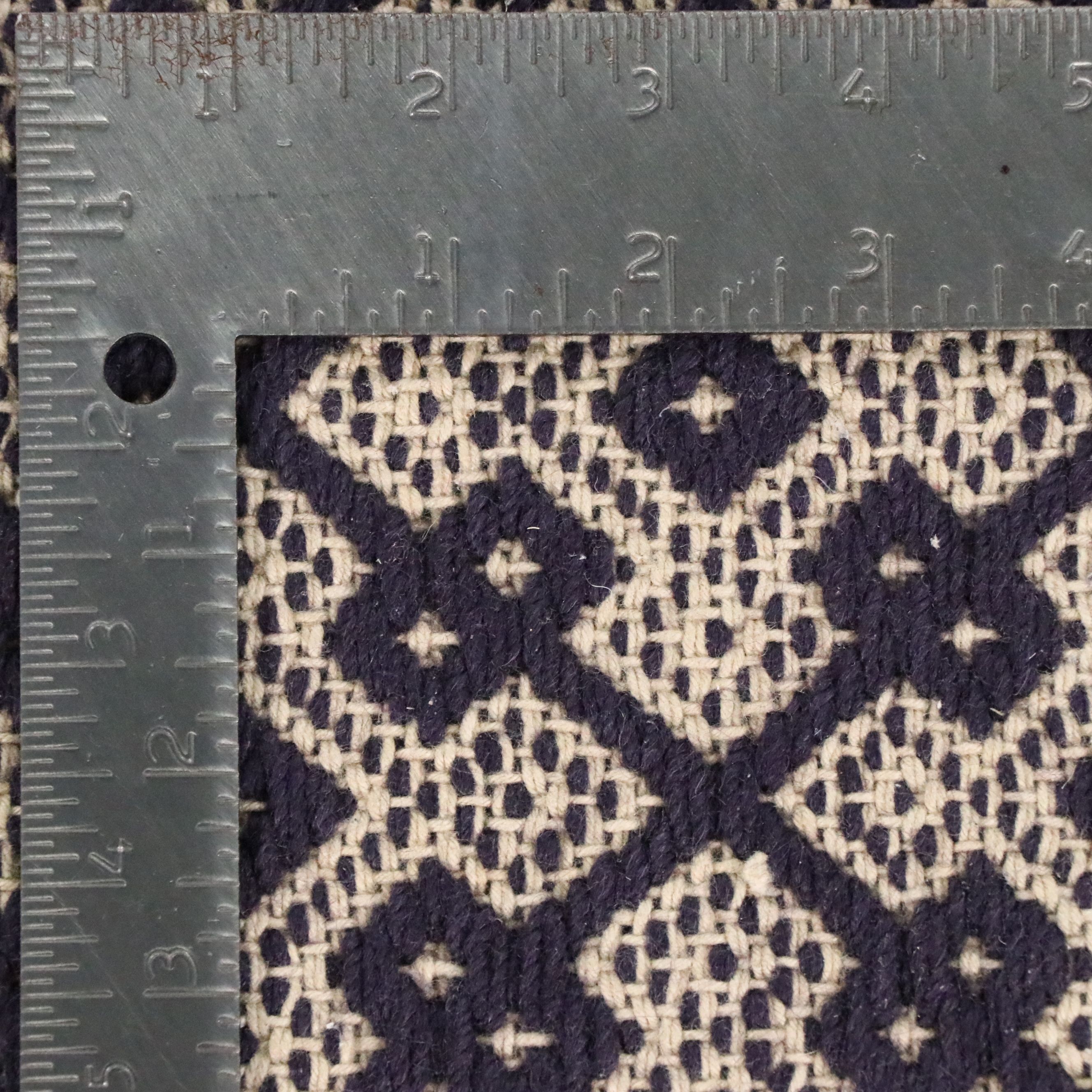 Navy Blue and White Geometric 4' x 7' Woven Tasseled Accent Rug