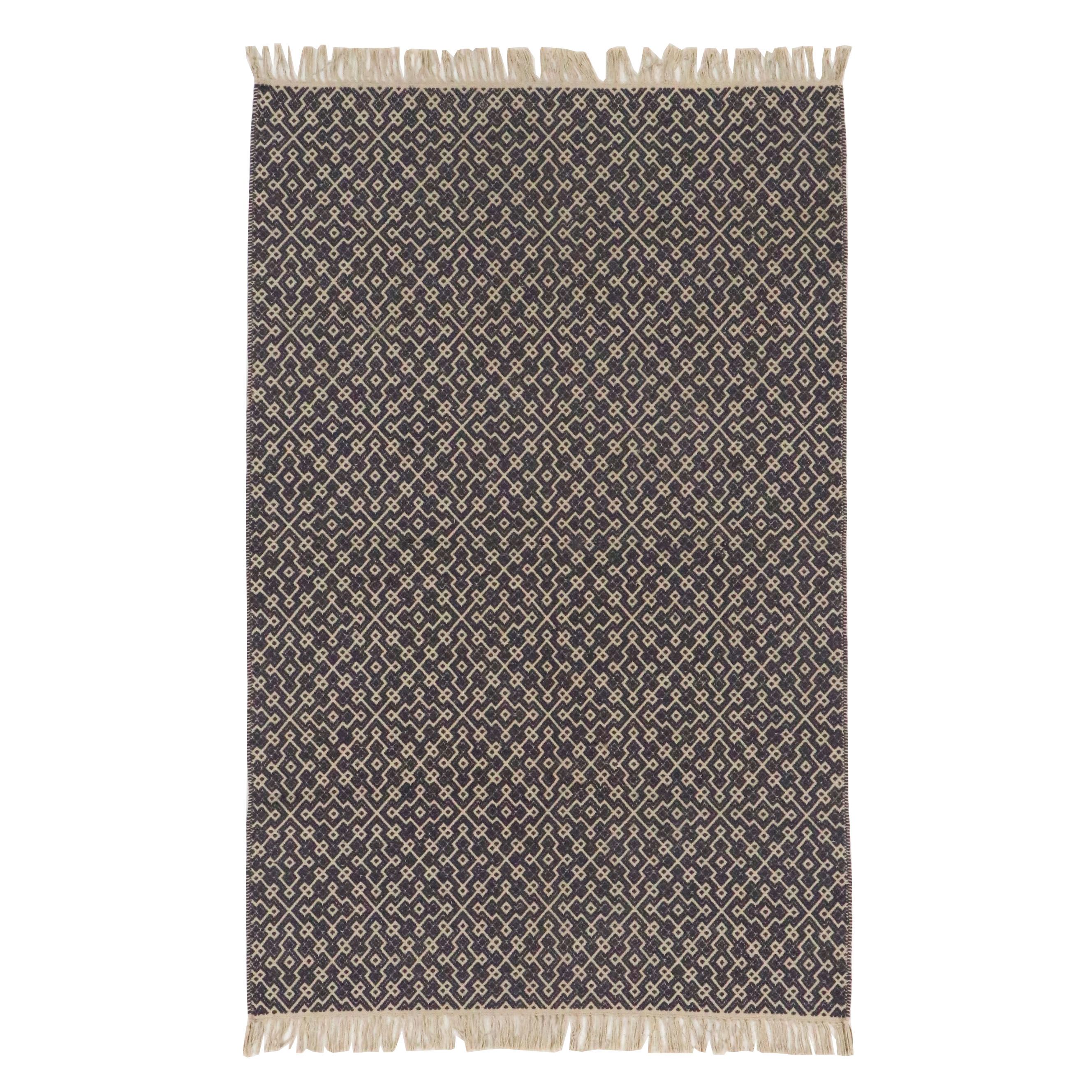 Navy Blue and White Geometric 4' x 7' Woven Tasseled Accent Rug