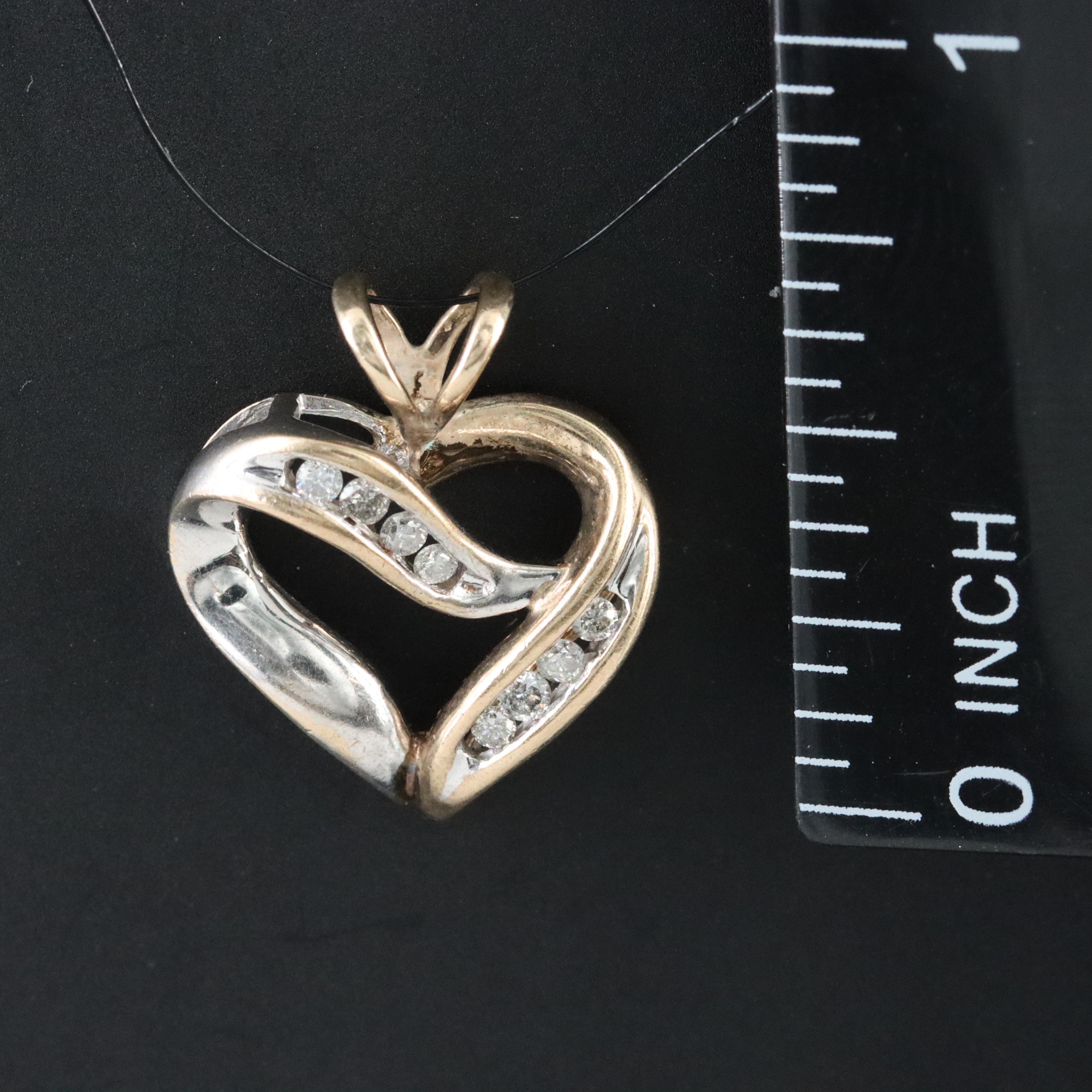 10K 0.12 CTW Diamond Heart Pendant