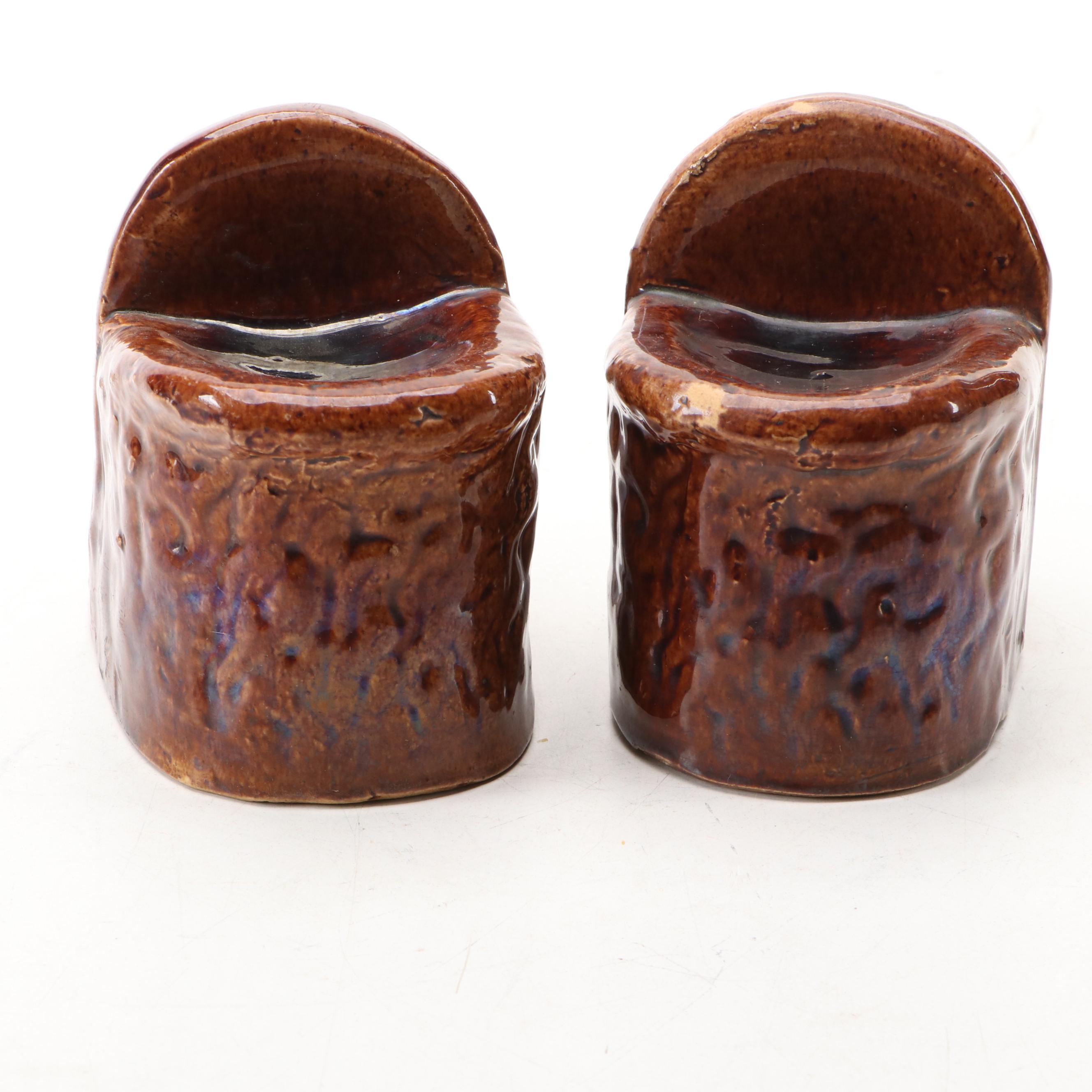 Pair of English Treacle Glaze Lion Head Window Sash Stops, 19th century