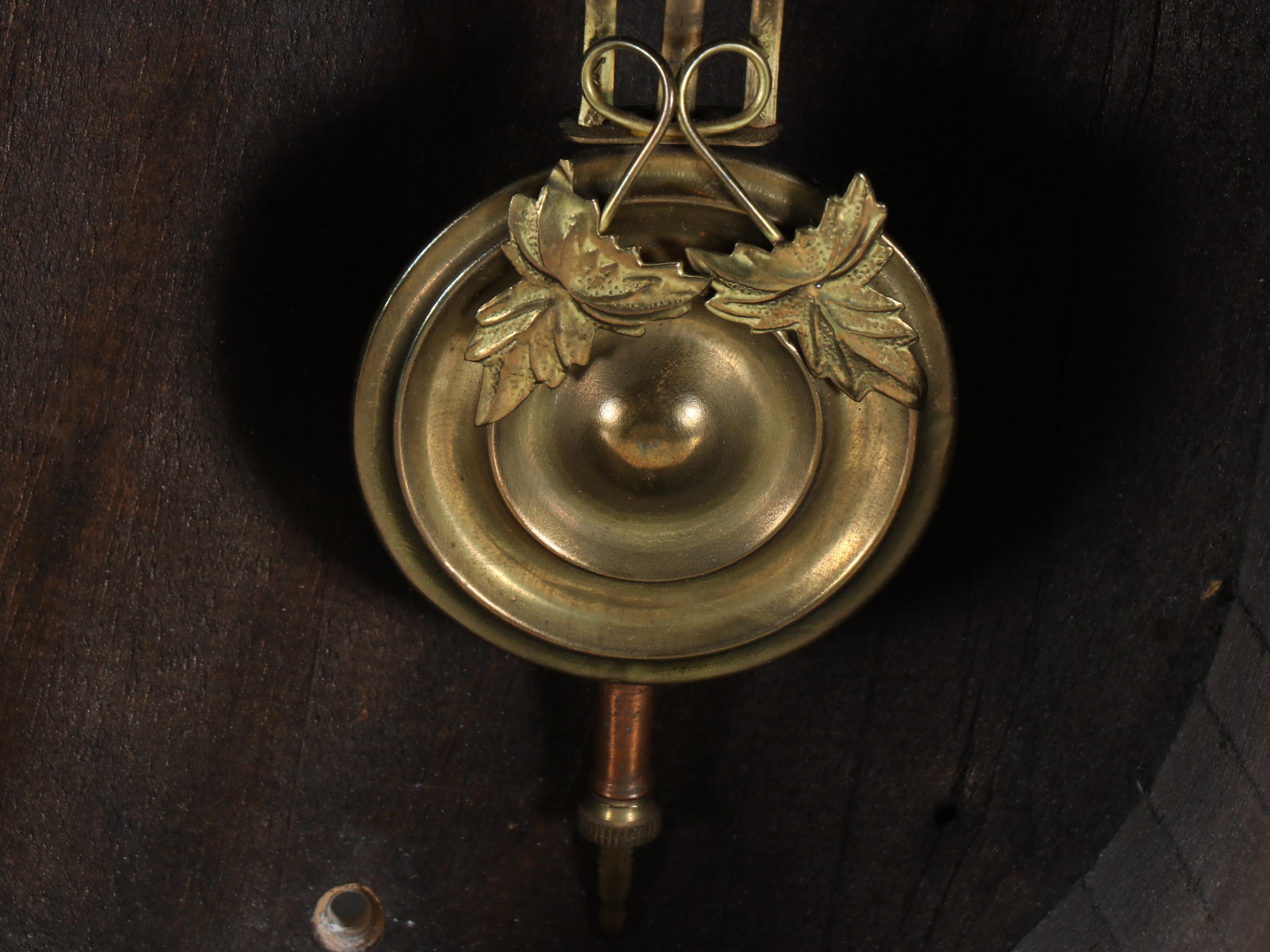 Figure-Eight Brass and Wooden Wall Clock