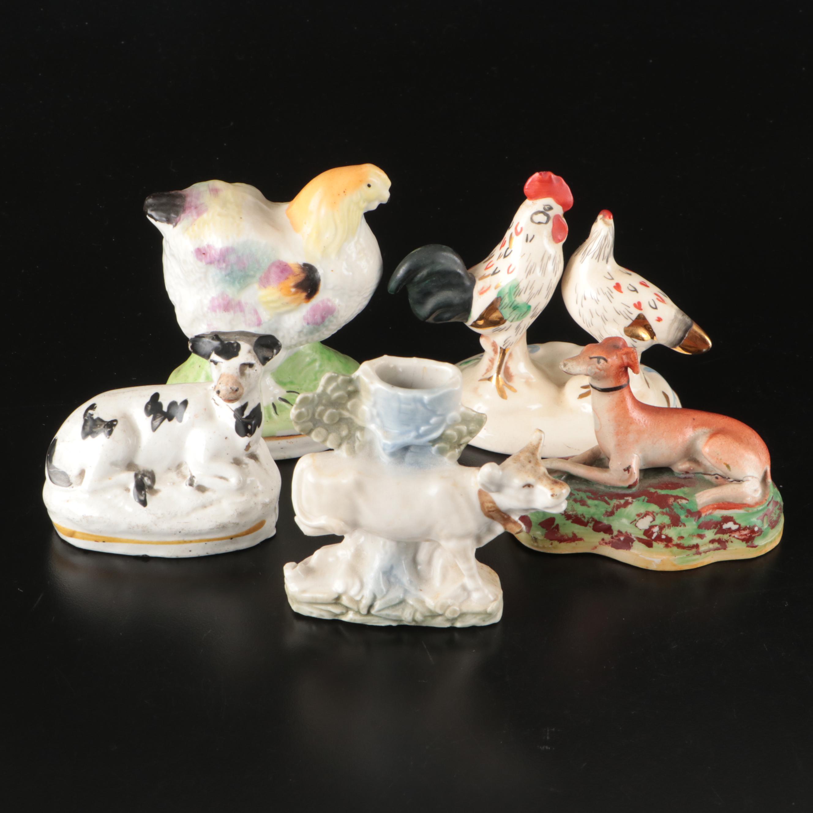 Staffordshire Reclining Greyhound with Other Figurines and Candle Holder