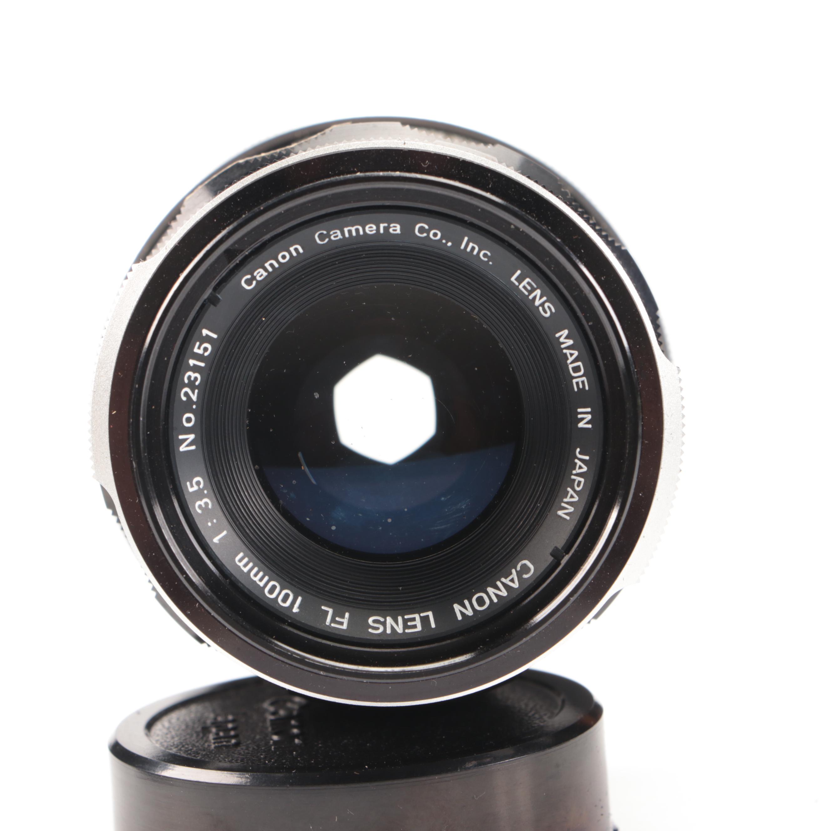 Bell & Howell / Canon FX 35mm Camera with Collection of Lenses, Leather Cases