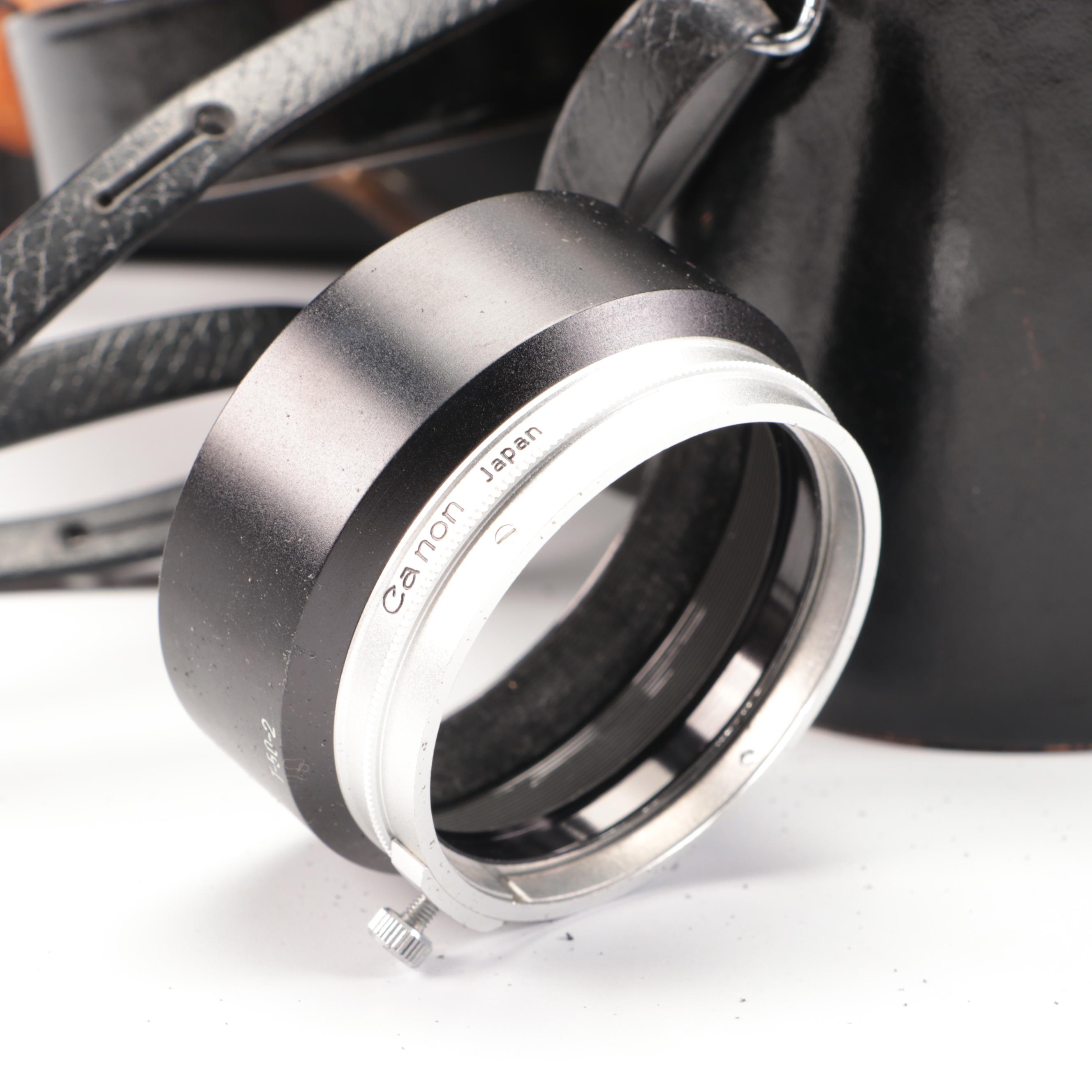 Bell & Howell / Canon FX 35mm Camera with Collection of Lenses, Leather Cases