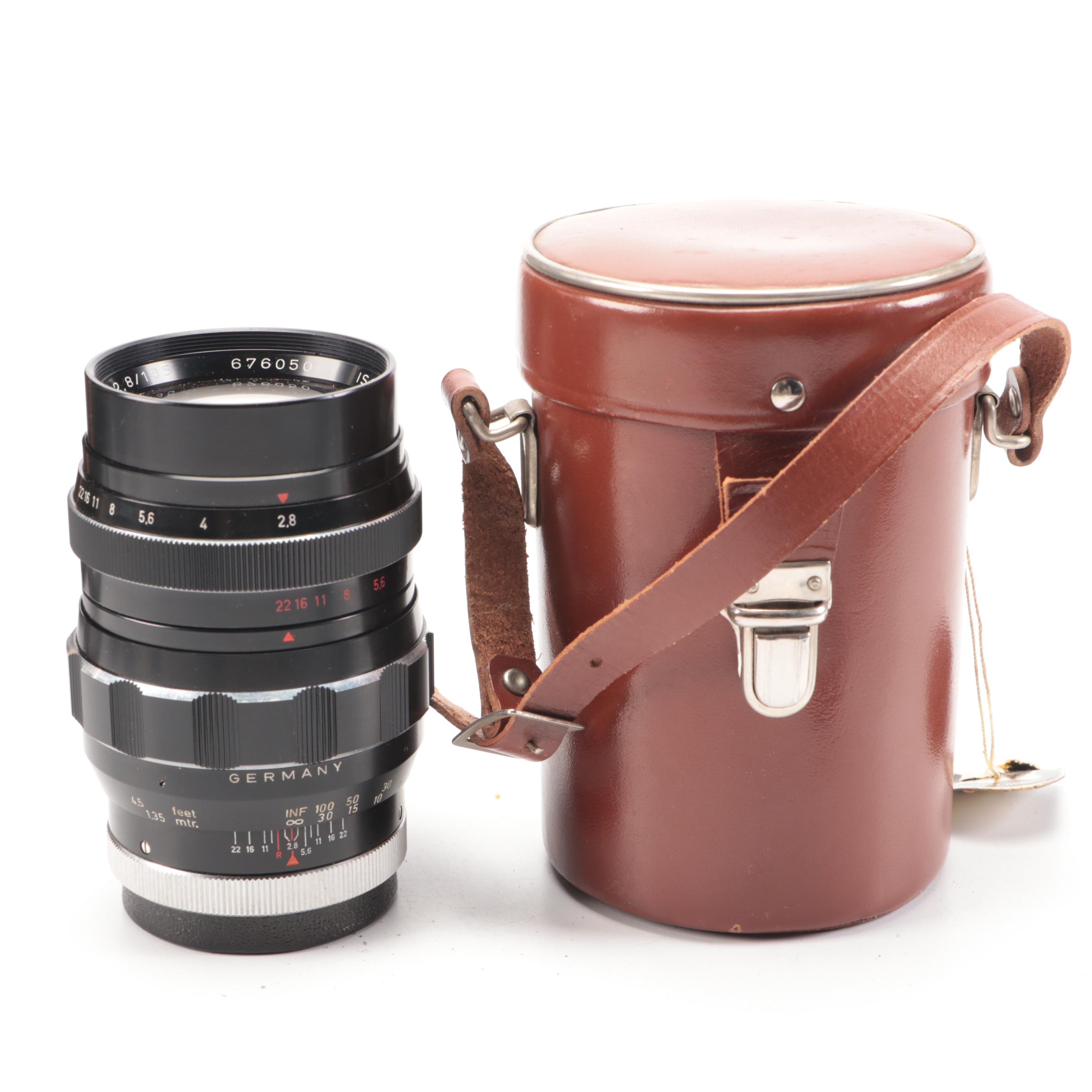 Bell & Howell / Canon FX 35mm Camera with Collection of Lenses, Leather Cases