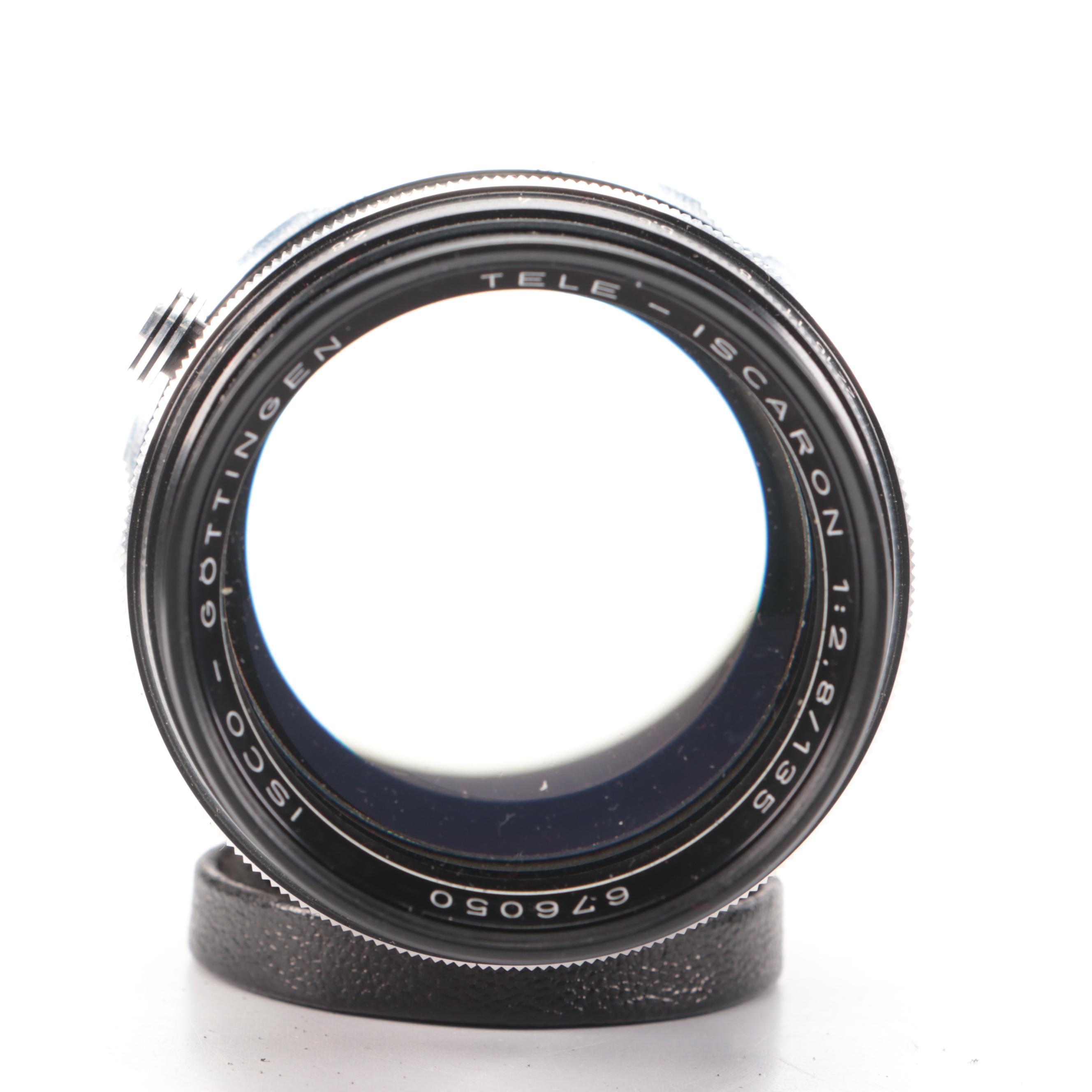 Bell & Howell / Canon FX 35mm Camera with Collection of Lenses, Leather Cases