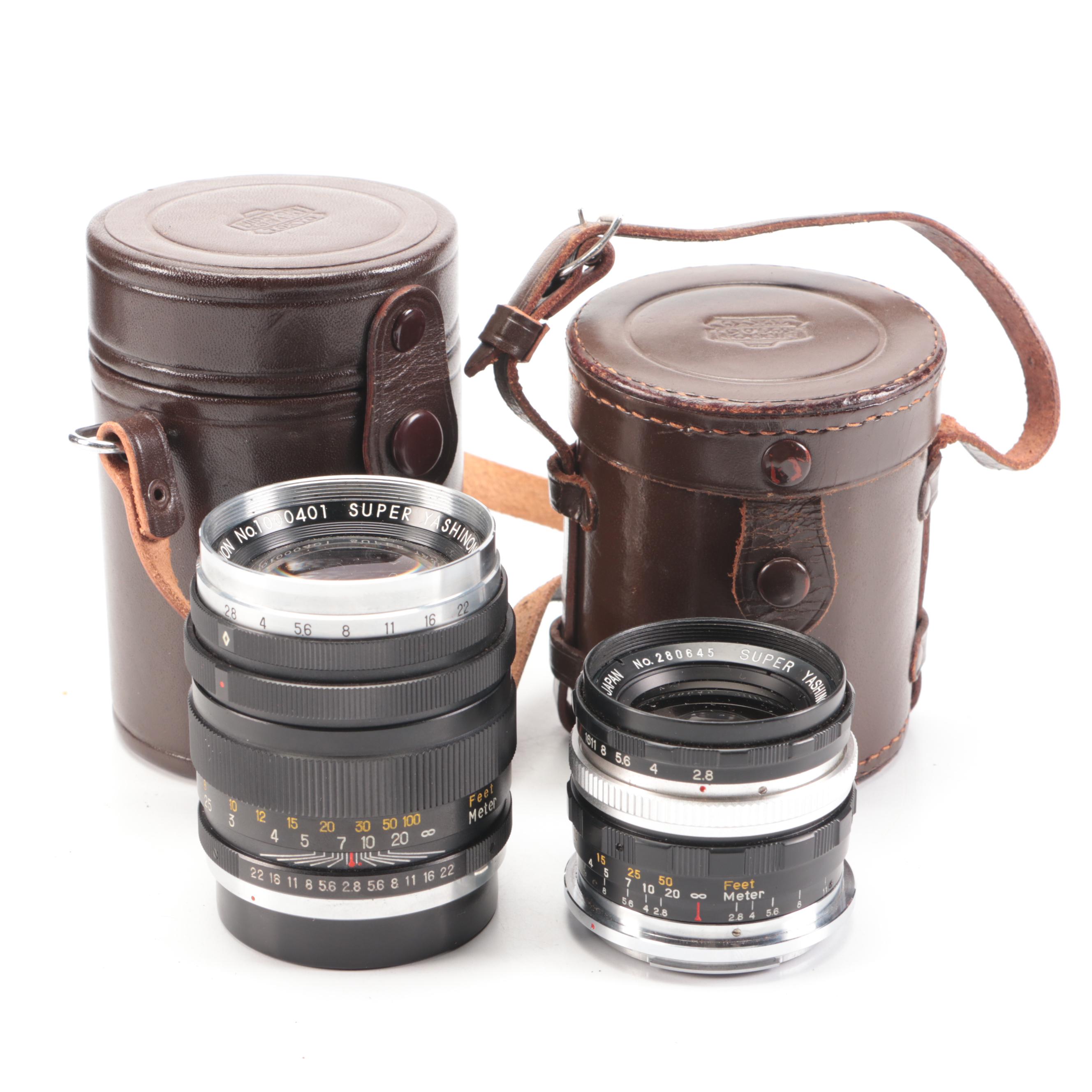 Bell & Howell / Canon FX 35mm Camera with Collection of Lenses, Leather Cases