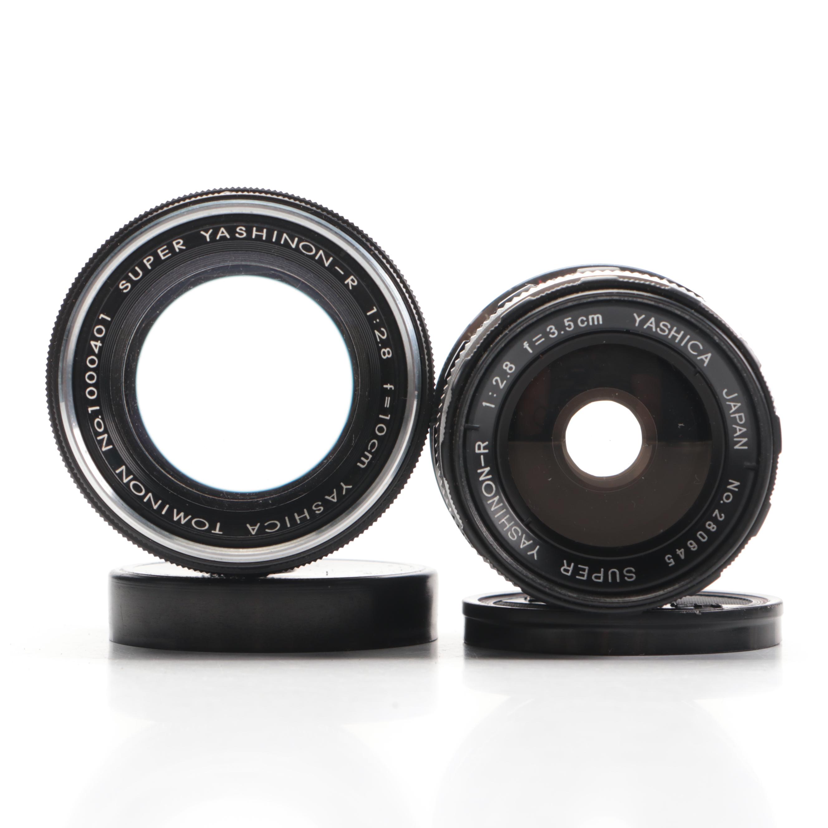 Bell & Howell / Canon FX 35mm Camera with Collection of Lenses, Leather Cases