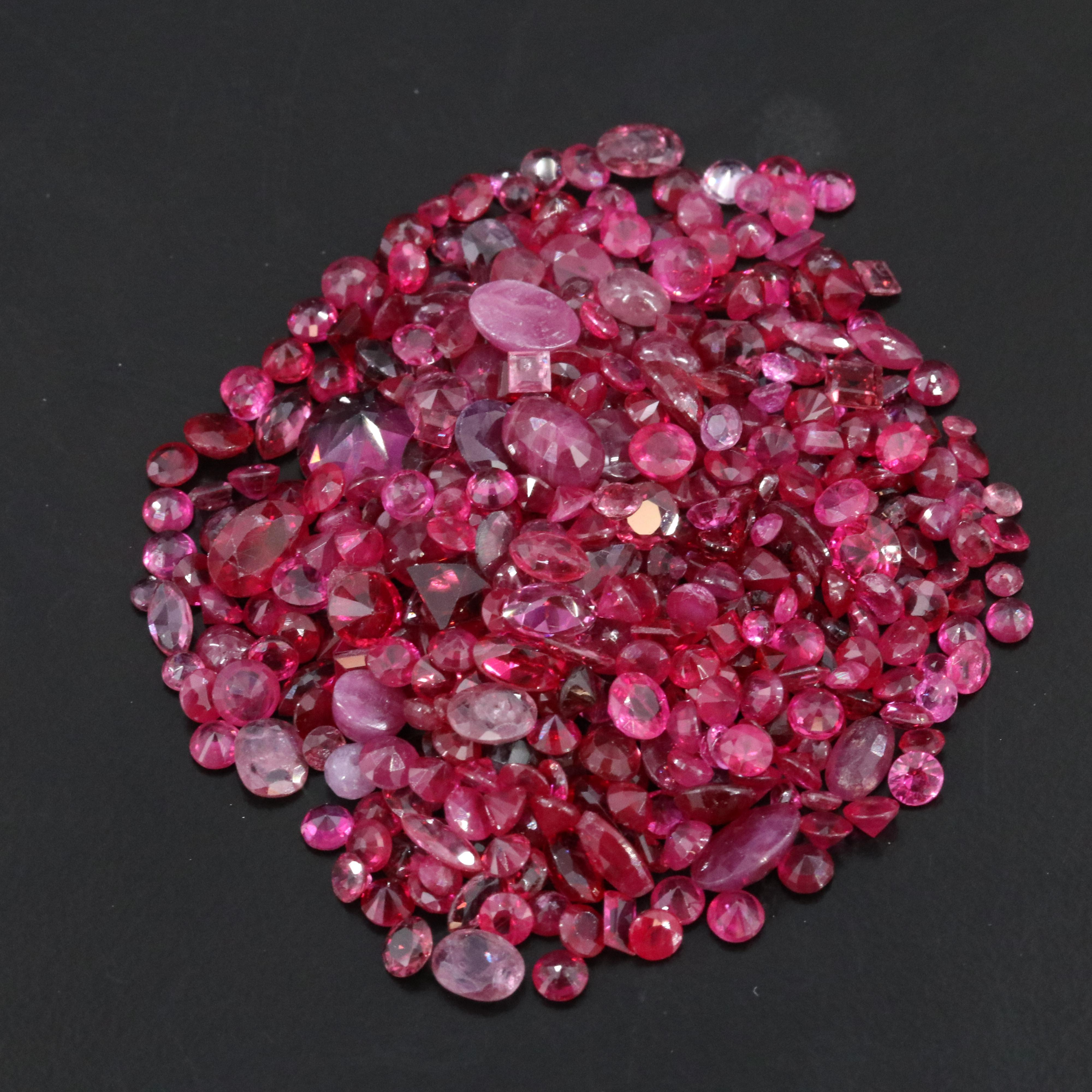 Loose 62.35 CTW Gemstone Lot Including Ruby, Lab Grown Ruby and Garnet