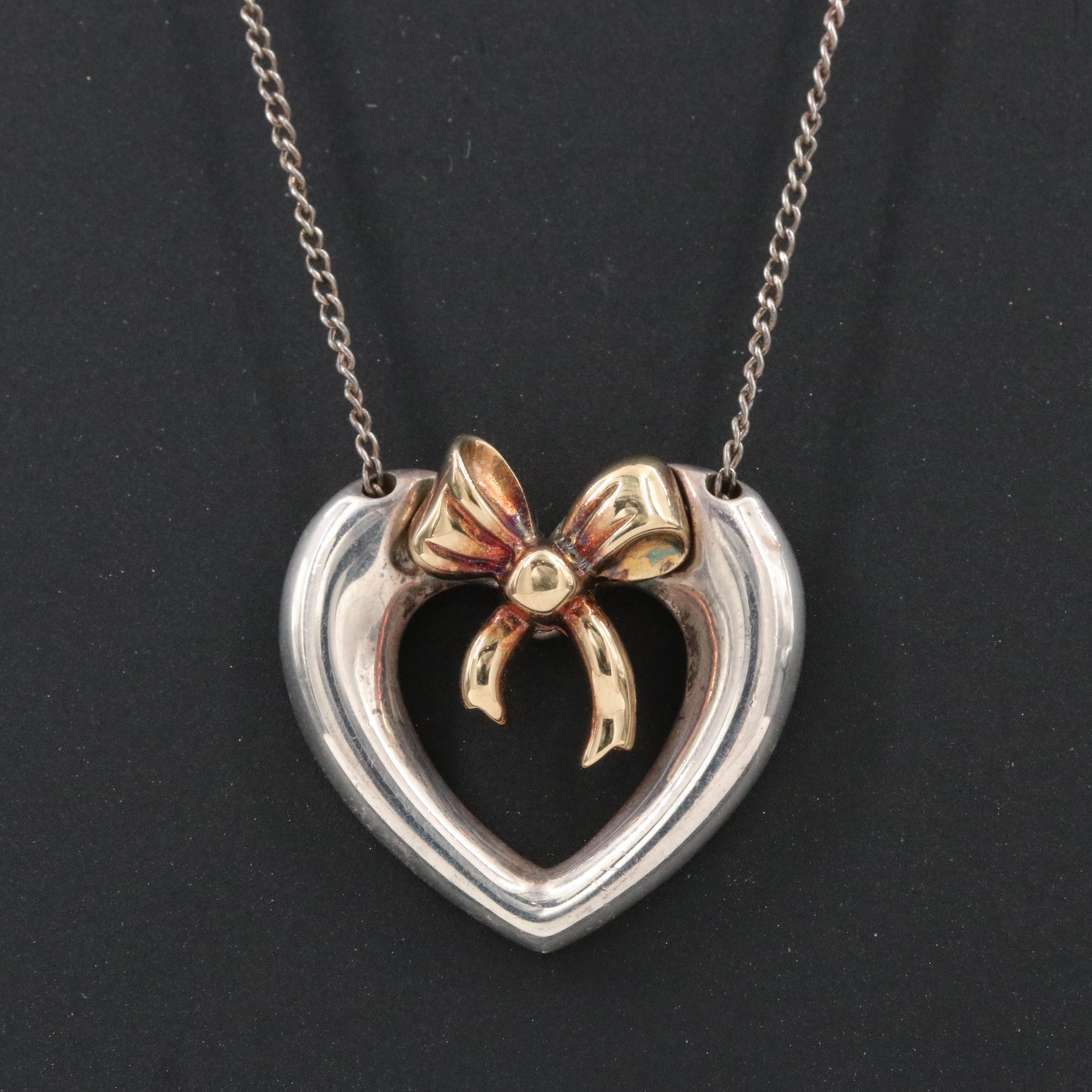 Tiffany & Co. 18K Gold Bow and Sterling Open Heart Necklace