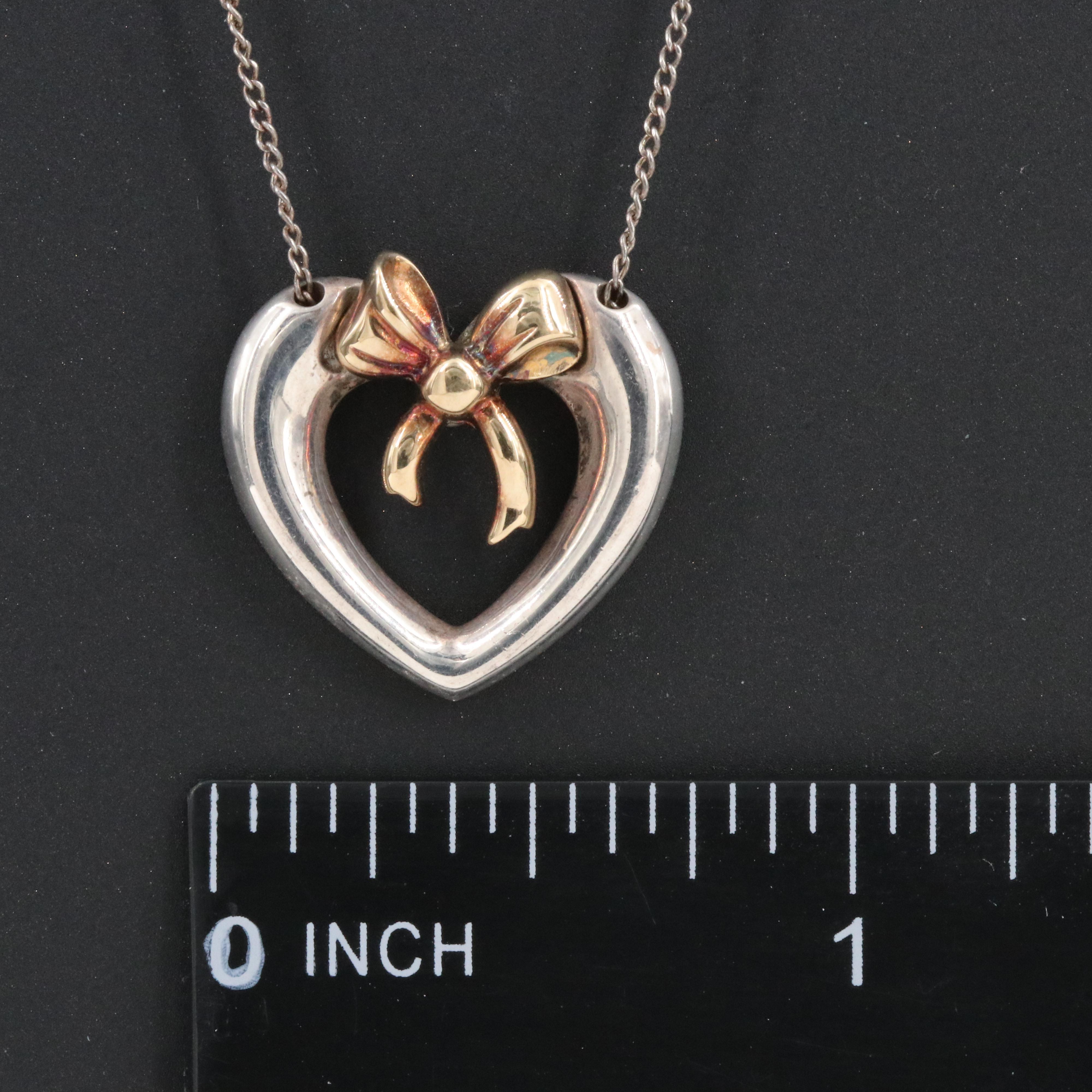 Tiffany & Co. 18K Gold Bow and Sterling Open Heart Necklace