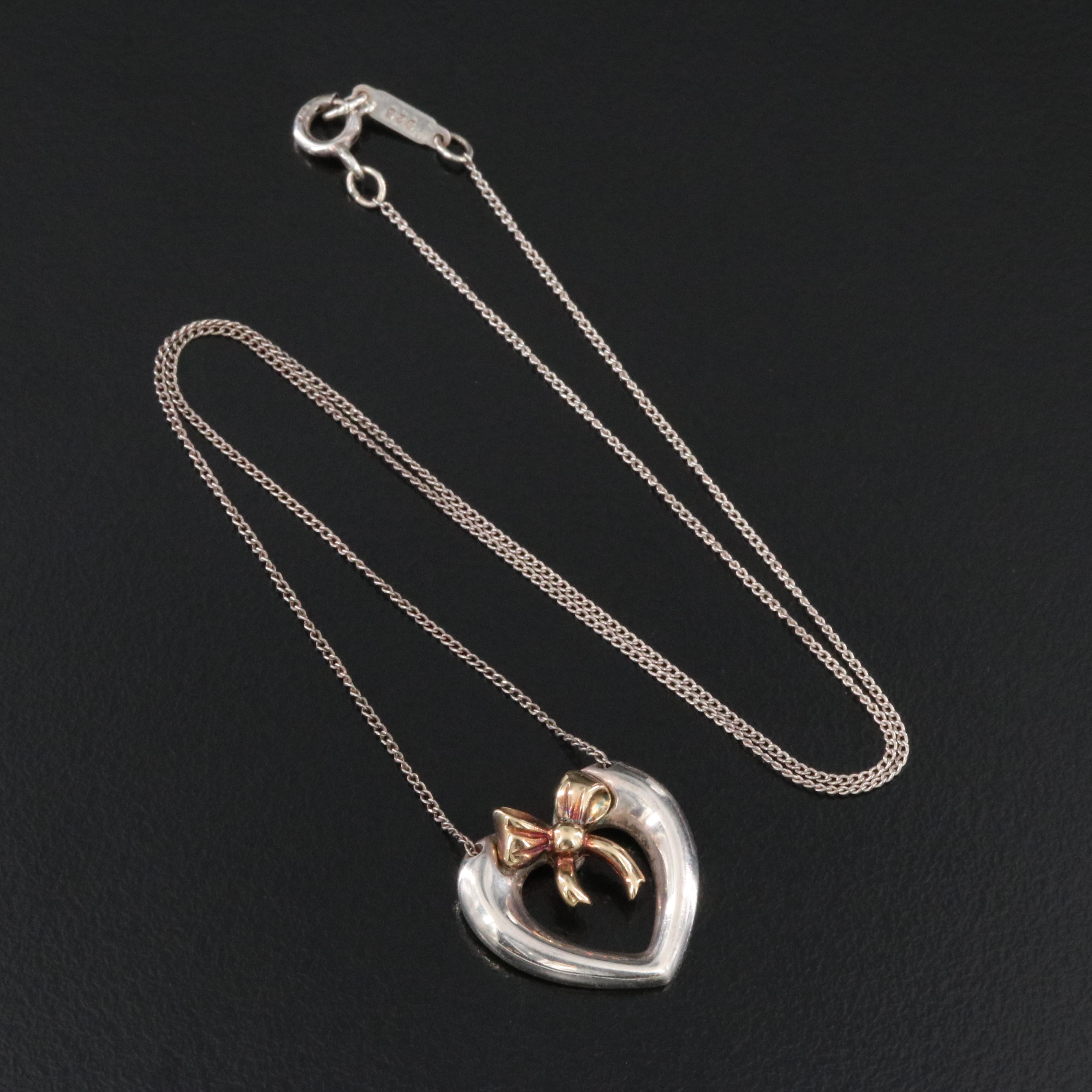 Tiffany & Co. 18K Gold Bow and Sterling Open Heart Necklace
