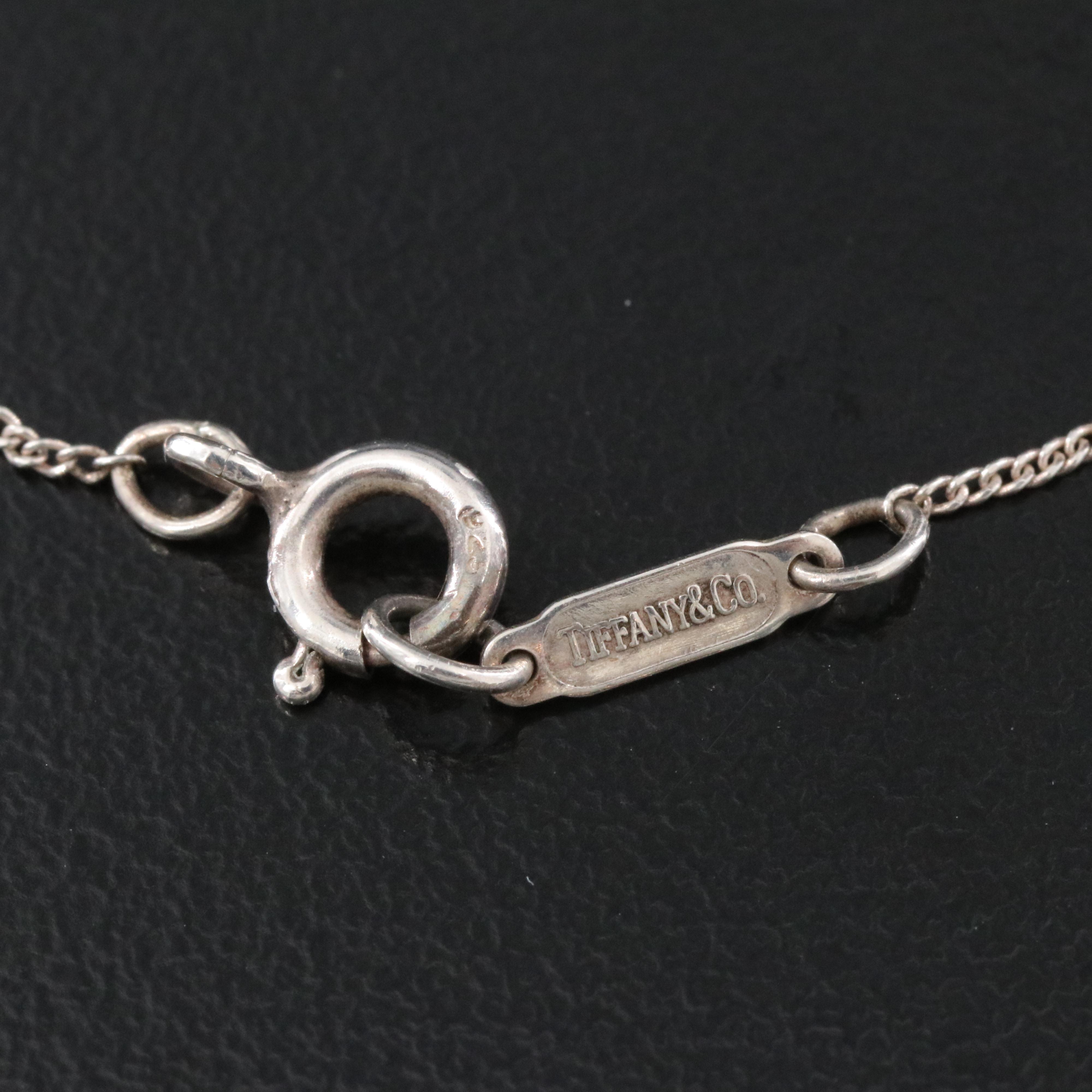 Tiffany & Co. 18K Gold Bow and Sterling Open Heart Necklace