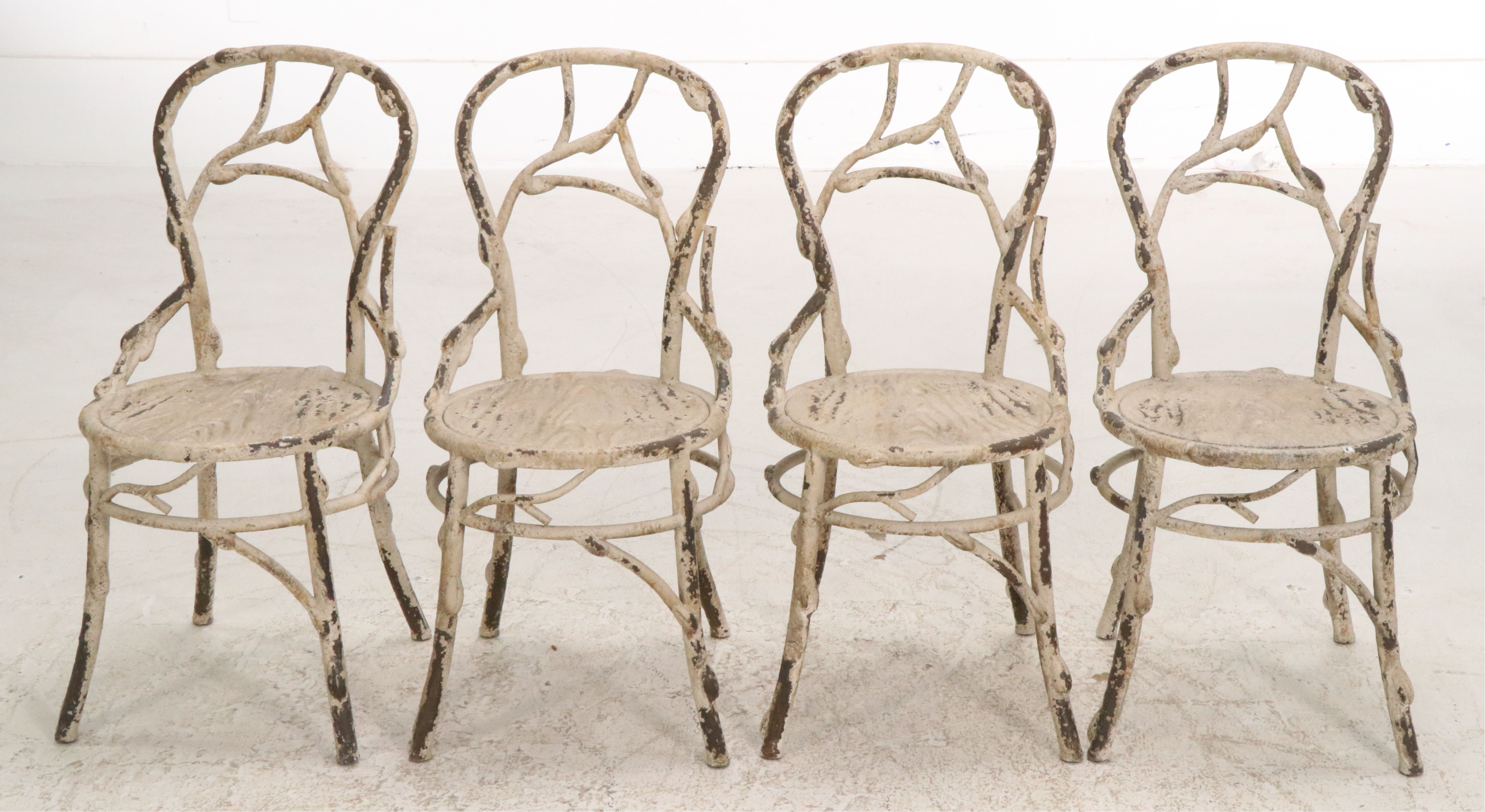 Set of Four Painted White Cast Metal Chairs