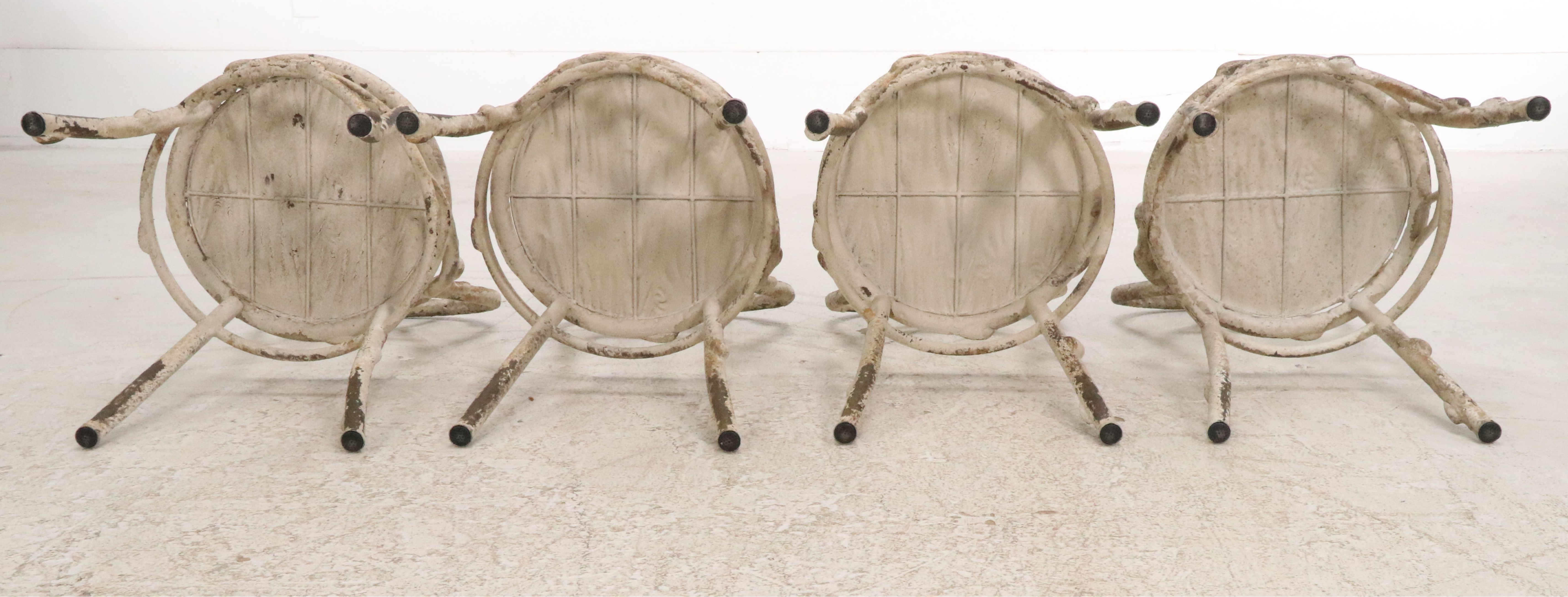 Set of Four Painted White Cast Metal Chairs