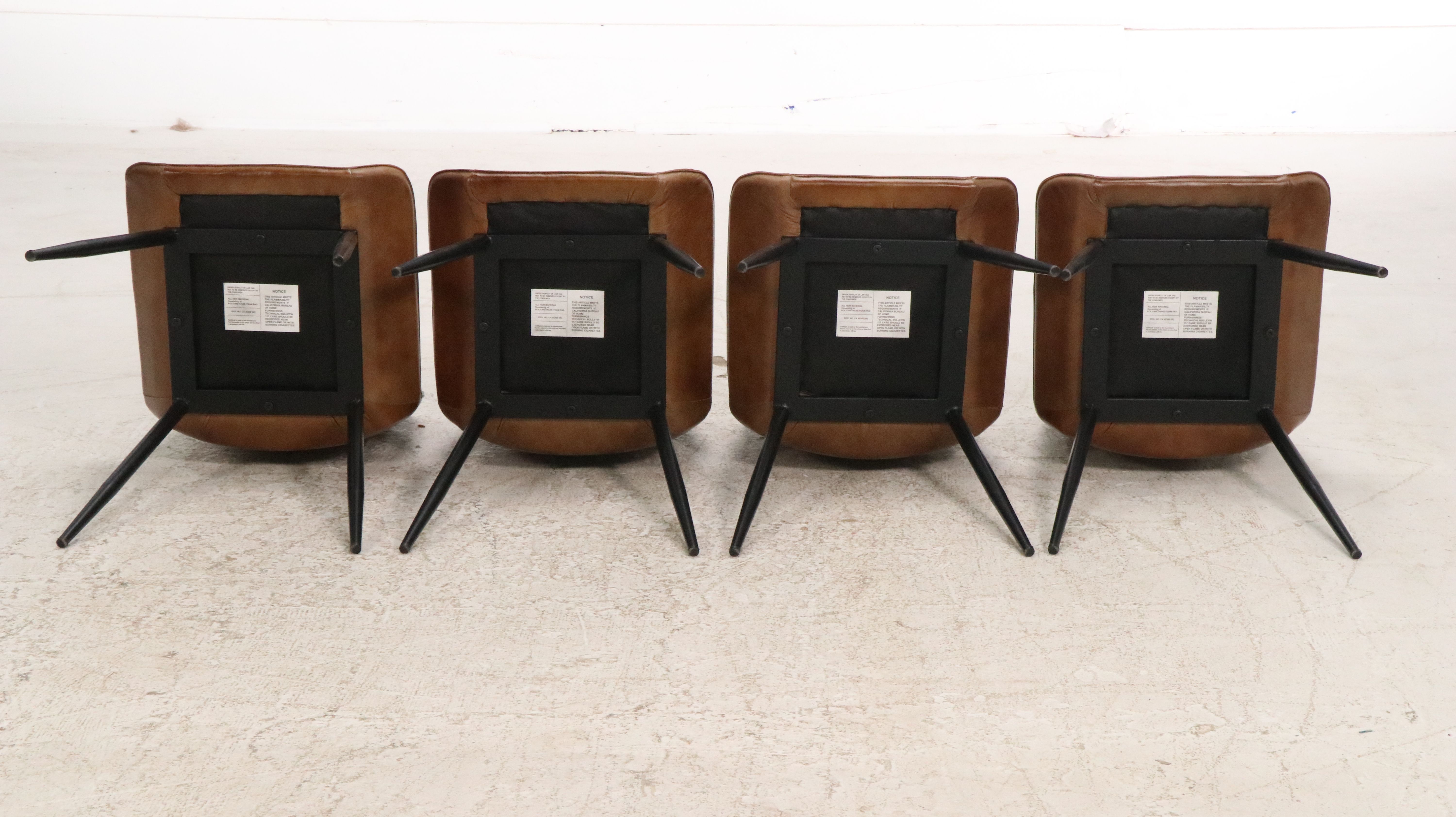Four Modernist Faux Leather Upholstered Dining Chairs