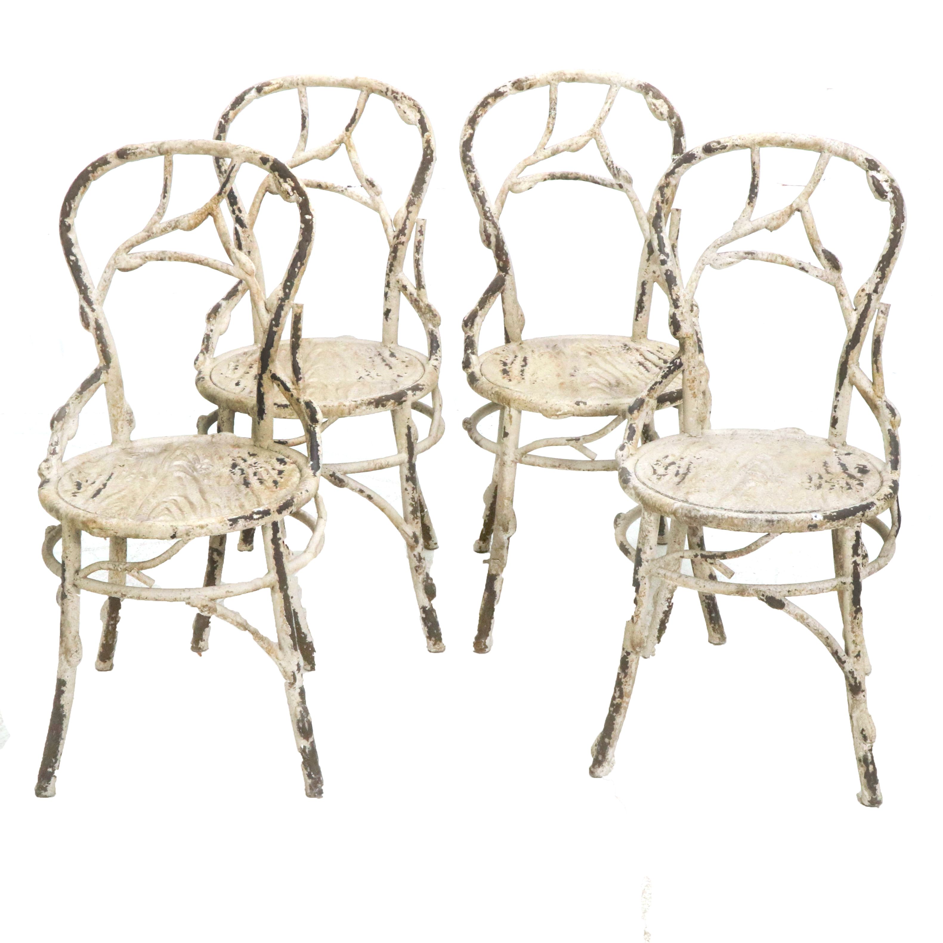 Set of Four Painted White Cast Metal Chairs