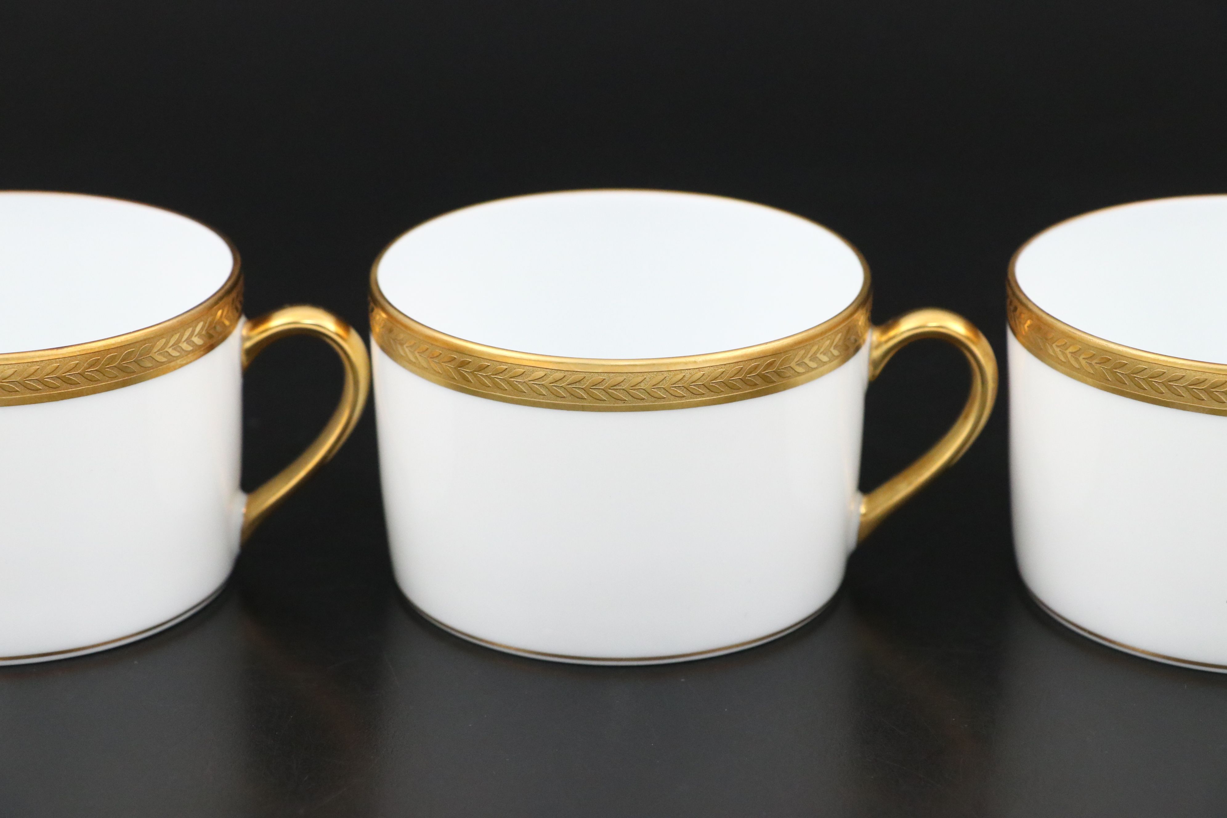 Bernardaud "Vienne" Cups and Saucers and Other Gilt Porcelain Dinnerware