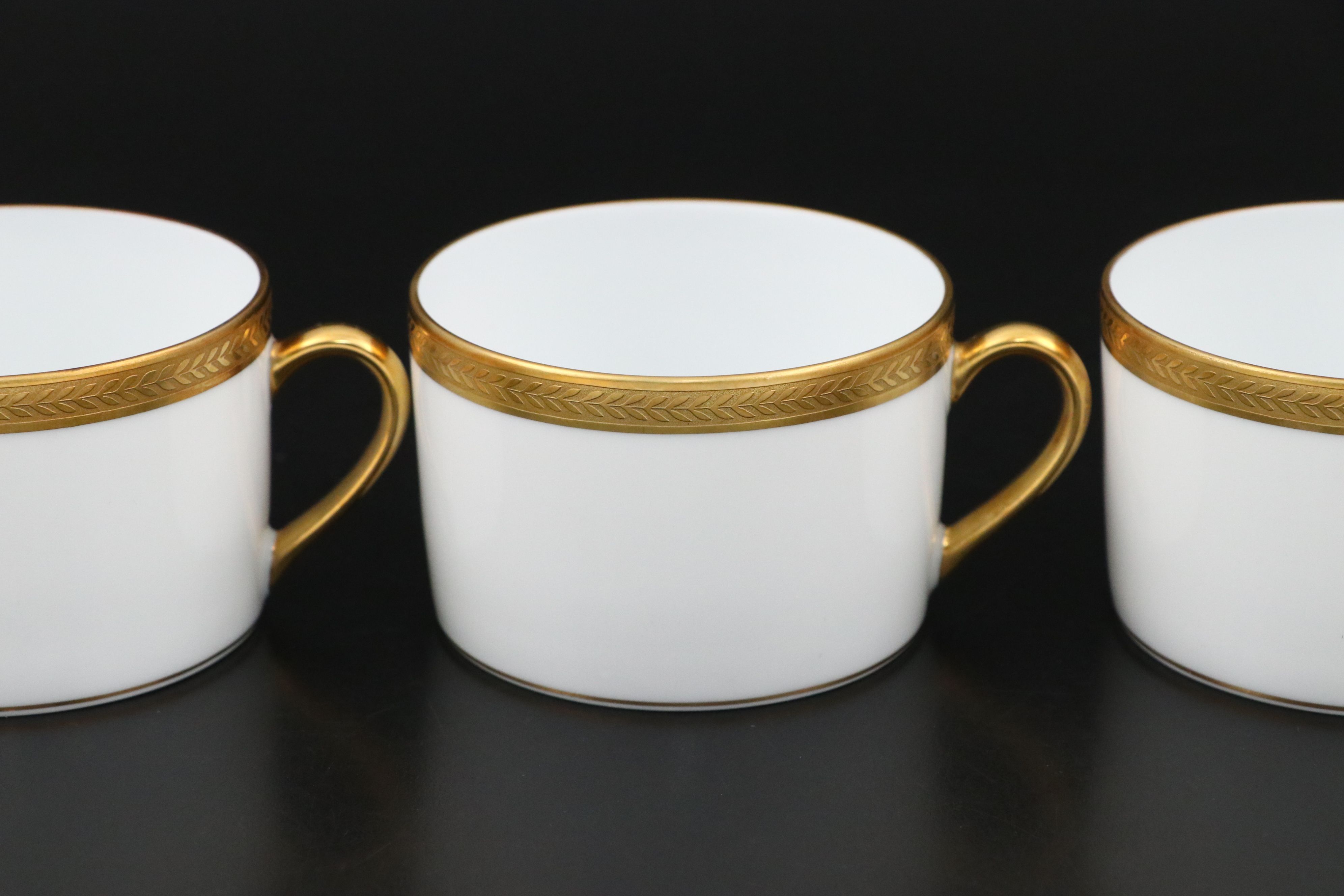 Bernardaud "Vienne" Cups and Saucers and Other Gilt Porcelain Dinnerware