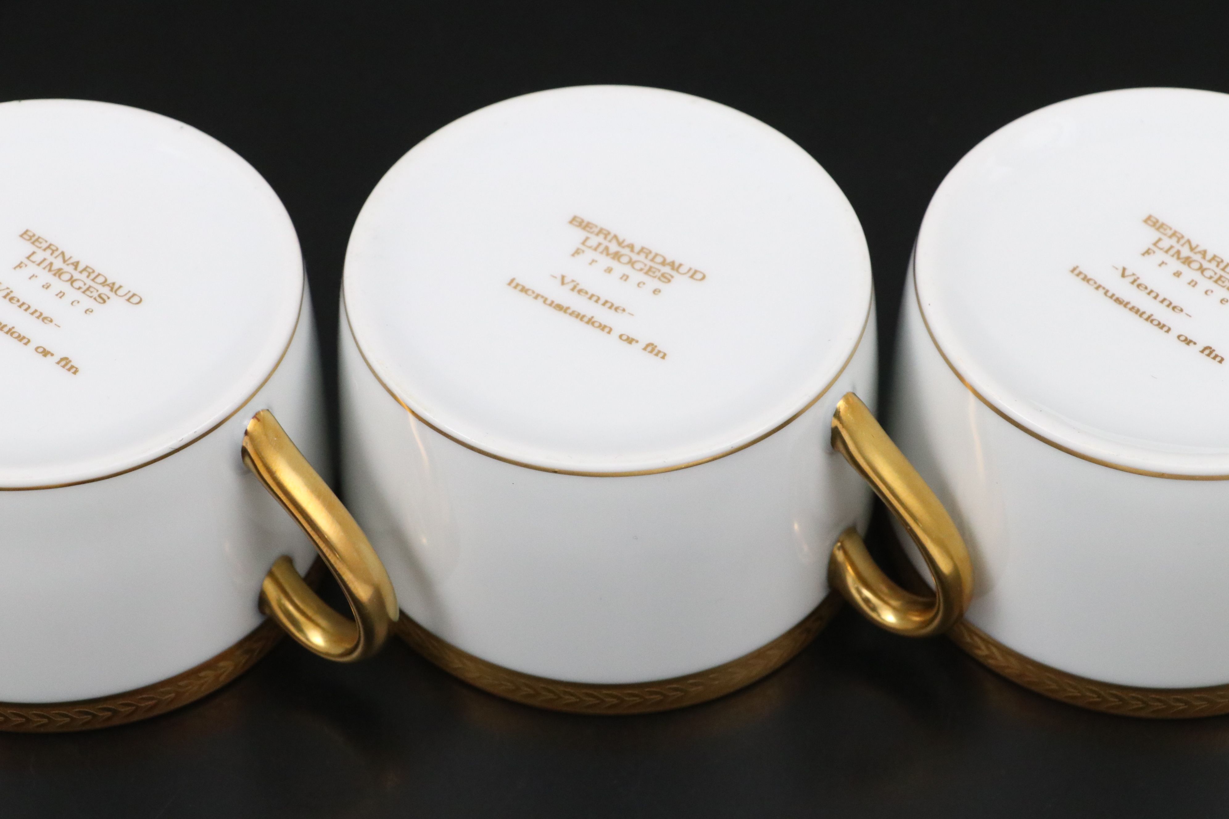 Bernardaud "Vienne" Cups and Saucers and Other Gilt Porcelain Dinnerware