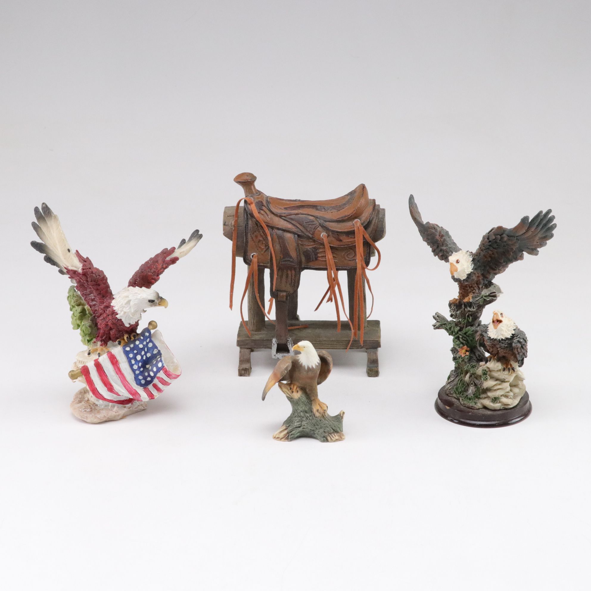 Carved Resin & Porcelain Eagles with American Flag and Western Saddle Figurines