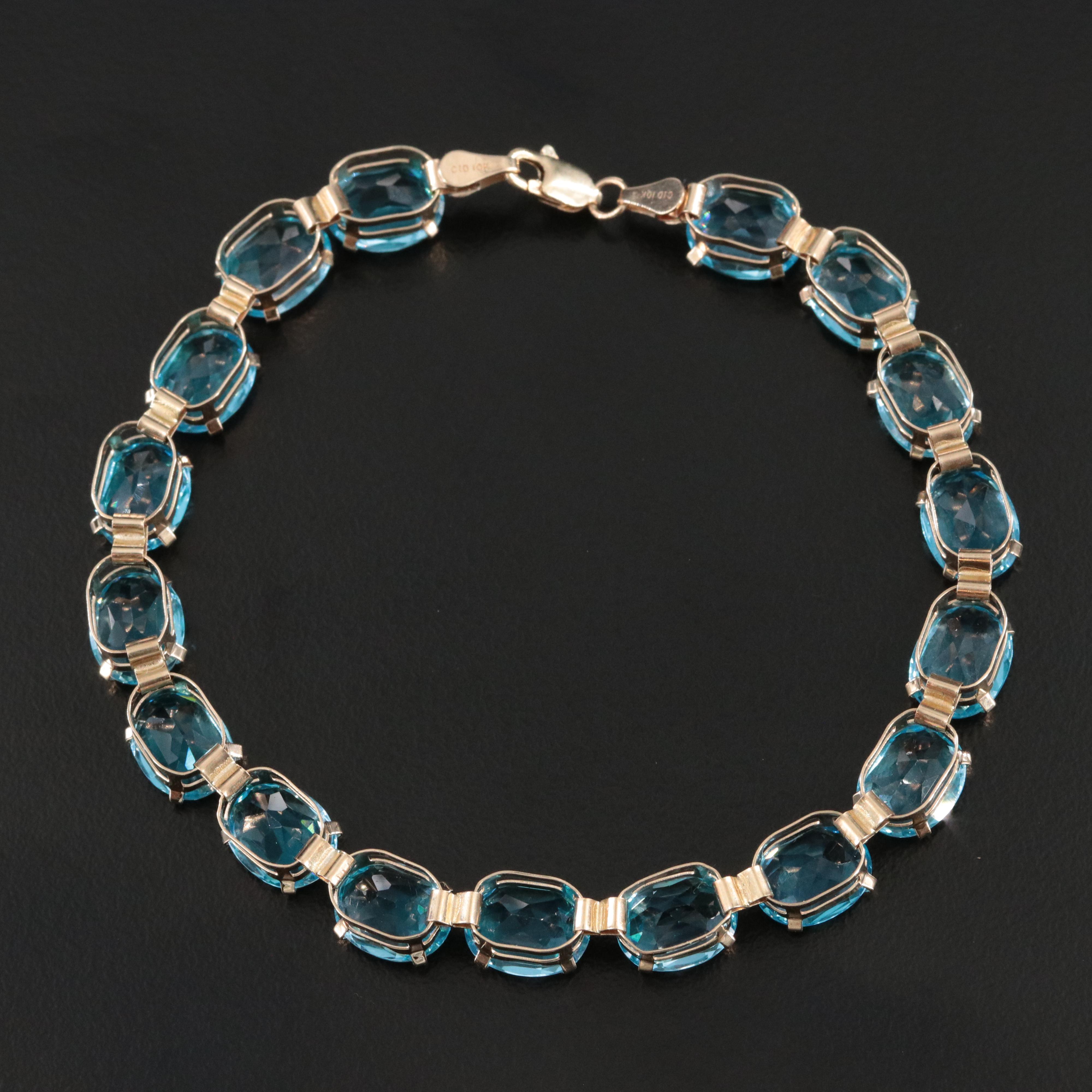 10K Blue Topaz Line Bracelet