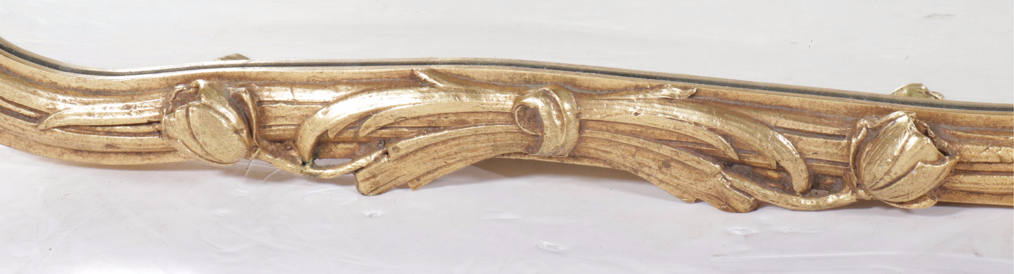 Decorative Arts, Inc. Hollywood Regency Style Carved Tulips Giltwood Wall Mirror