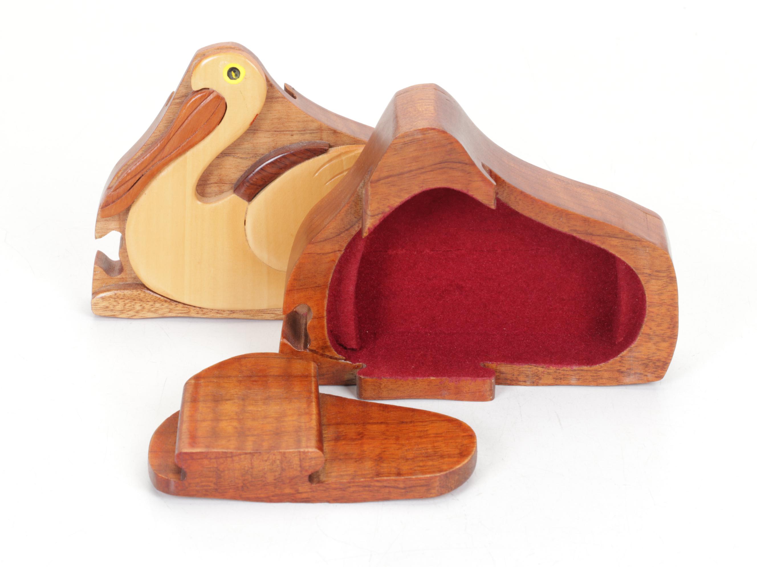 Hand-Carved Wooden Pelican Puzzle Box and Collection of Pelicans