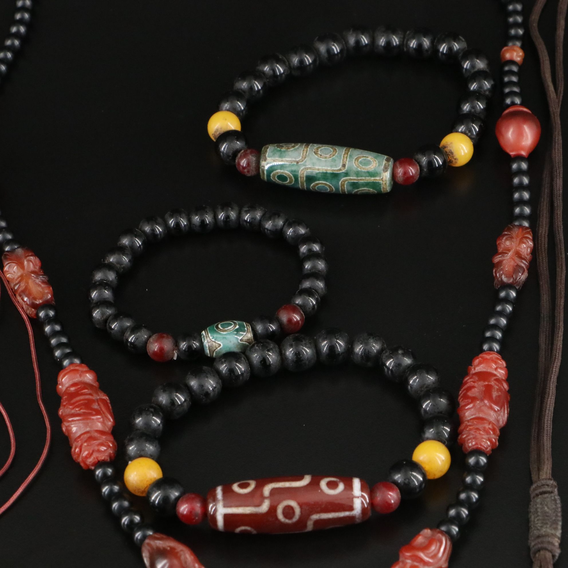 Black Onyx, Carnelian and Prayer Beads Featured in Necklaces and Bracelets