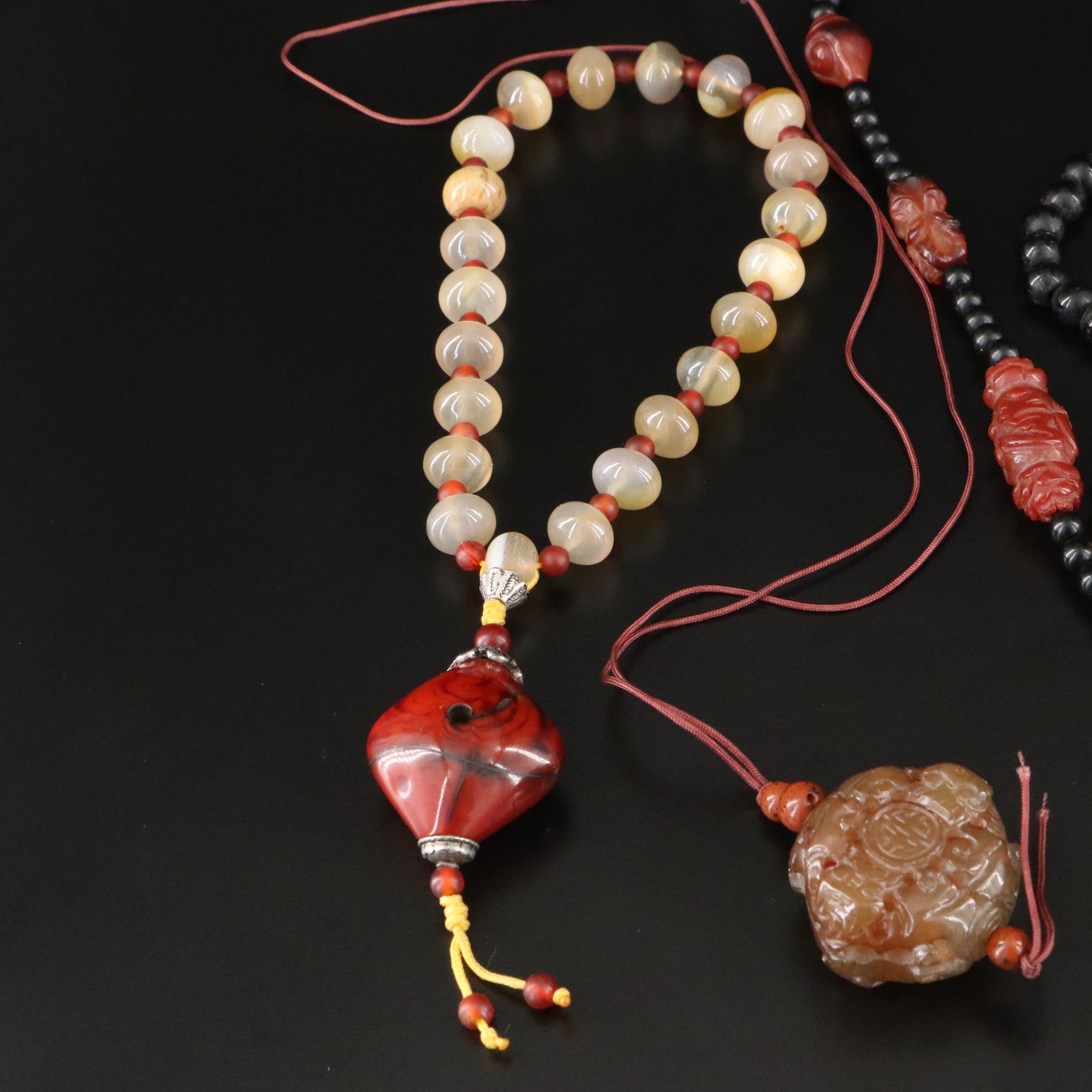 Black Onyx, Carnelian and Prayer Beads Featured in Necklaces and Bracelets