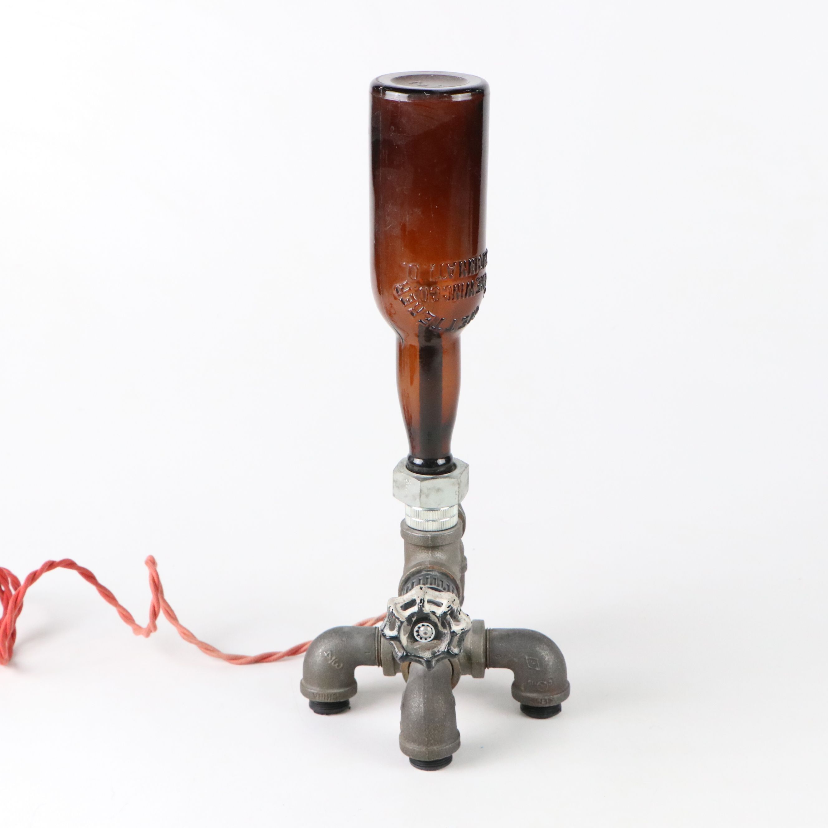 Industrial Modern Spigot Lamp with Amber Bottle Shade