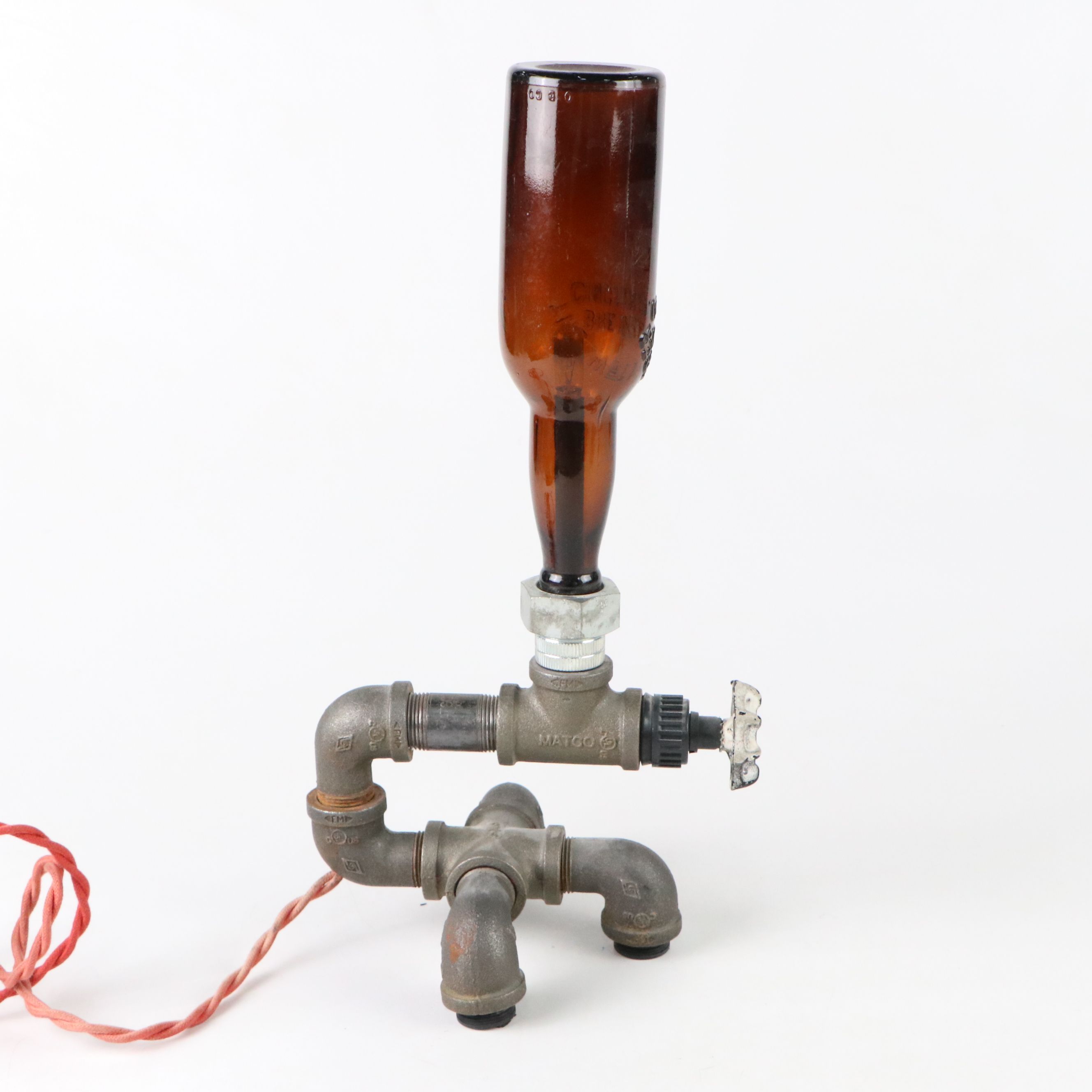 Industrial Modern Spigot Lamp with Amber Bottle Shade