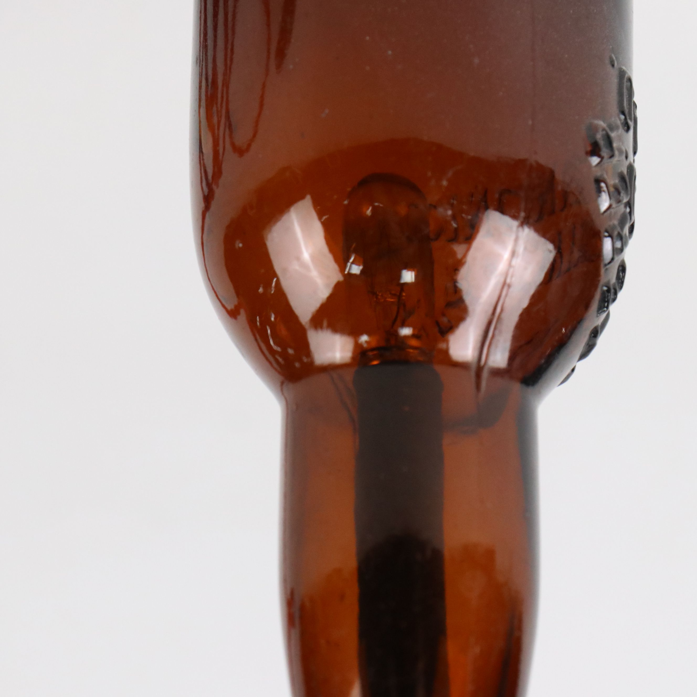 Industrial Modern Spigot Lamp with Amber Bottle Shade