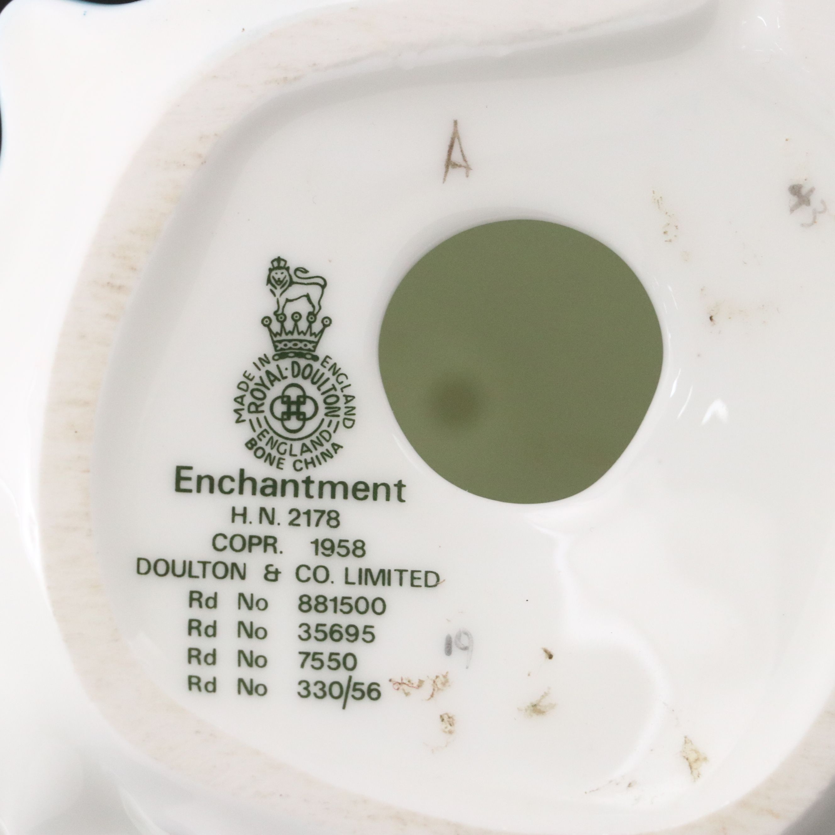 Lladró "Attentive Bunny with Flowers" and Royal Doulton "Enchantment" Figurines