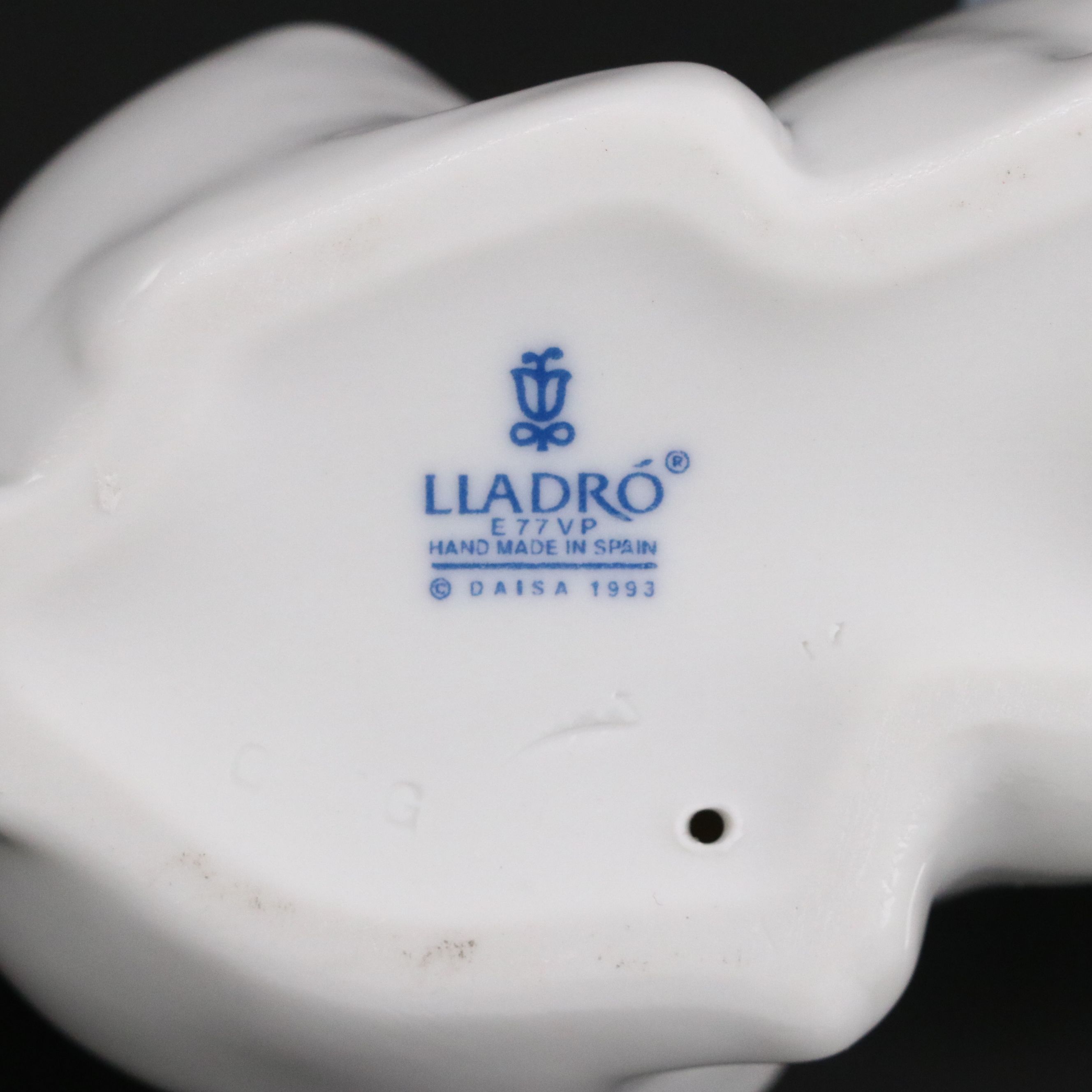 Lladró "Attentive Bunny with Flowers" and Royal Doulton "Enchantment" Figurines