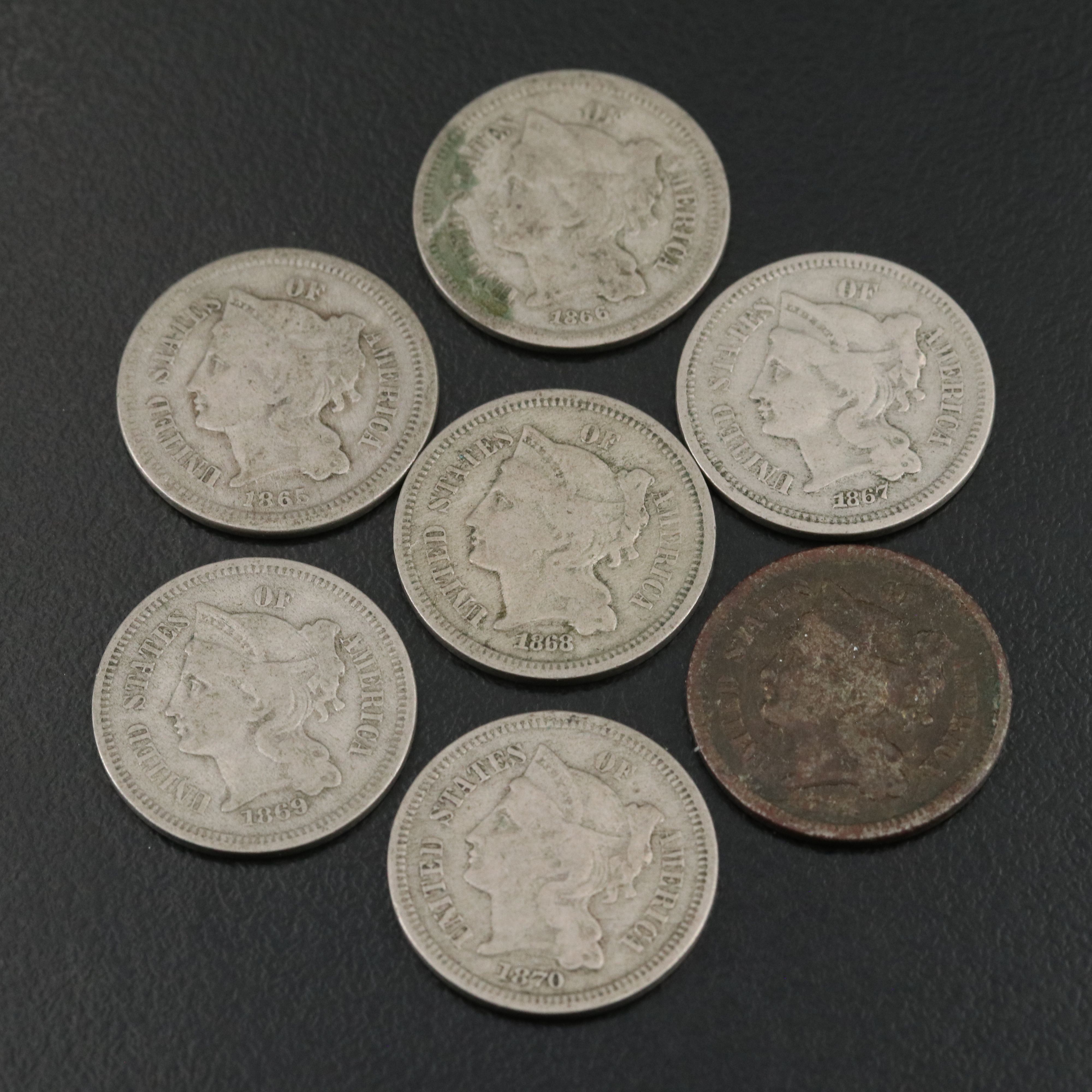 7 different U.S. three cent nickels 1865, 1866, 1867, 1868, 1869, 1870, and 1974