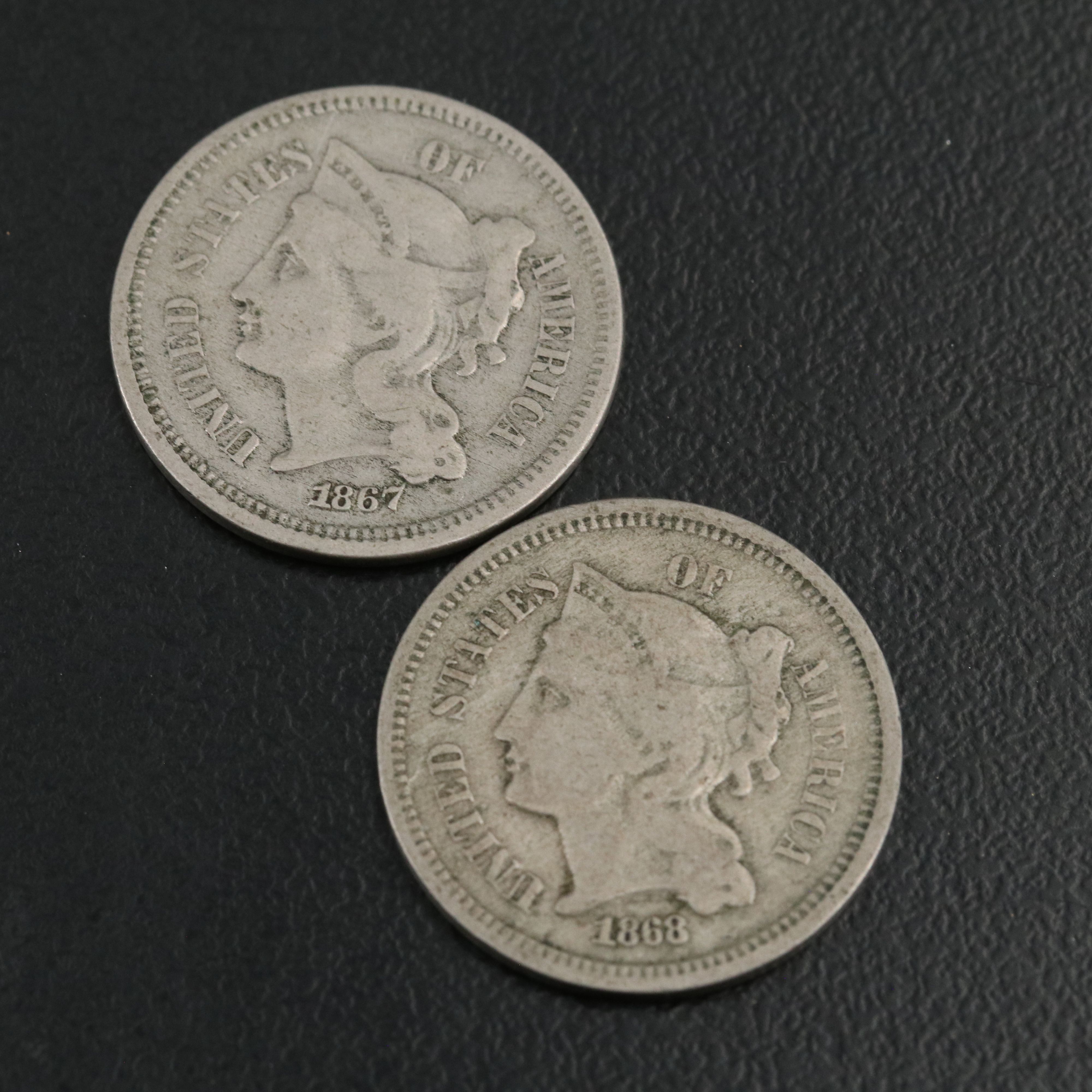 7 different U.S. three cent nickels 1865, 1866, 1867, 1868, 1869, 1870, and 1974