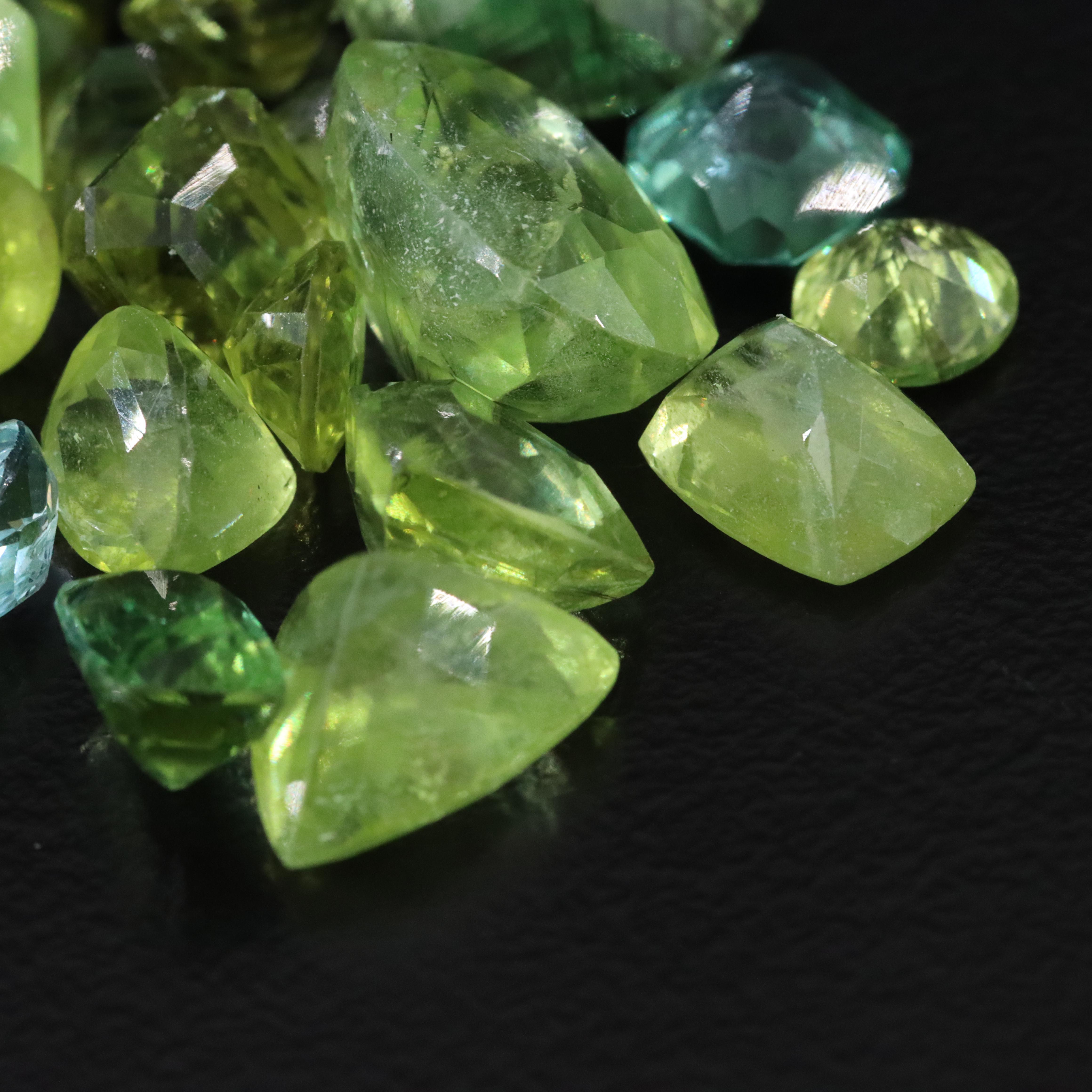 Loose 57.75 CTW Assorted Gemstones with Peridot, Tourmaline and Blue Topaz